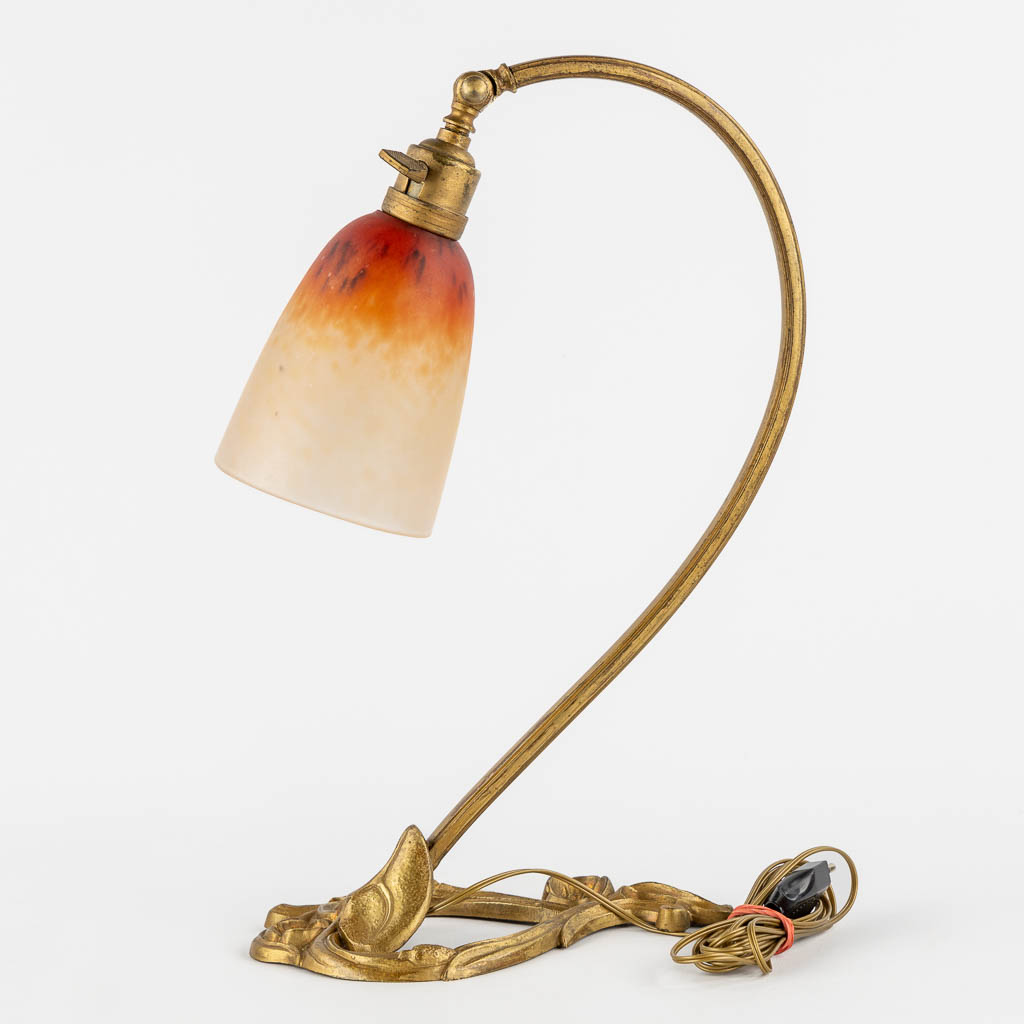 Schneider, an Art Nouveau period table lamp. (L:15 x W:25 x H:37 cm)