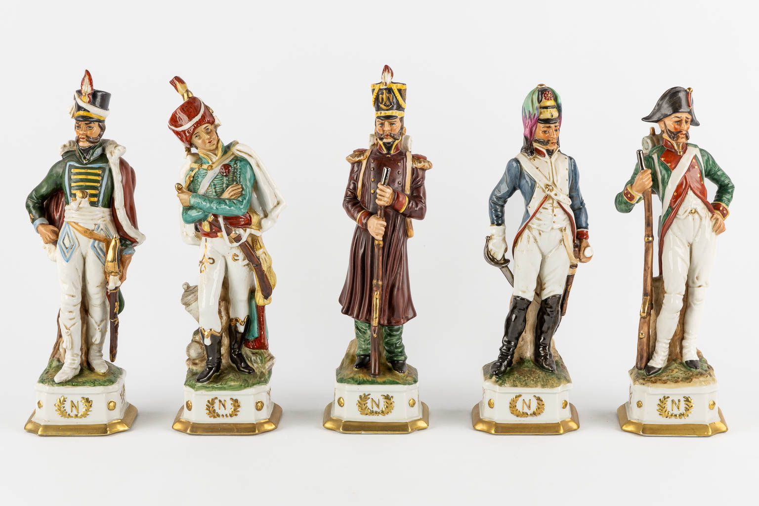 Napoleon and the generals, polychrome porcelain. 15 + 3 pieces. (L:9,5 x W:10 x H:31 cm)