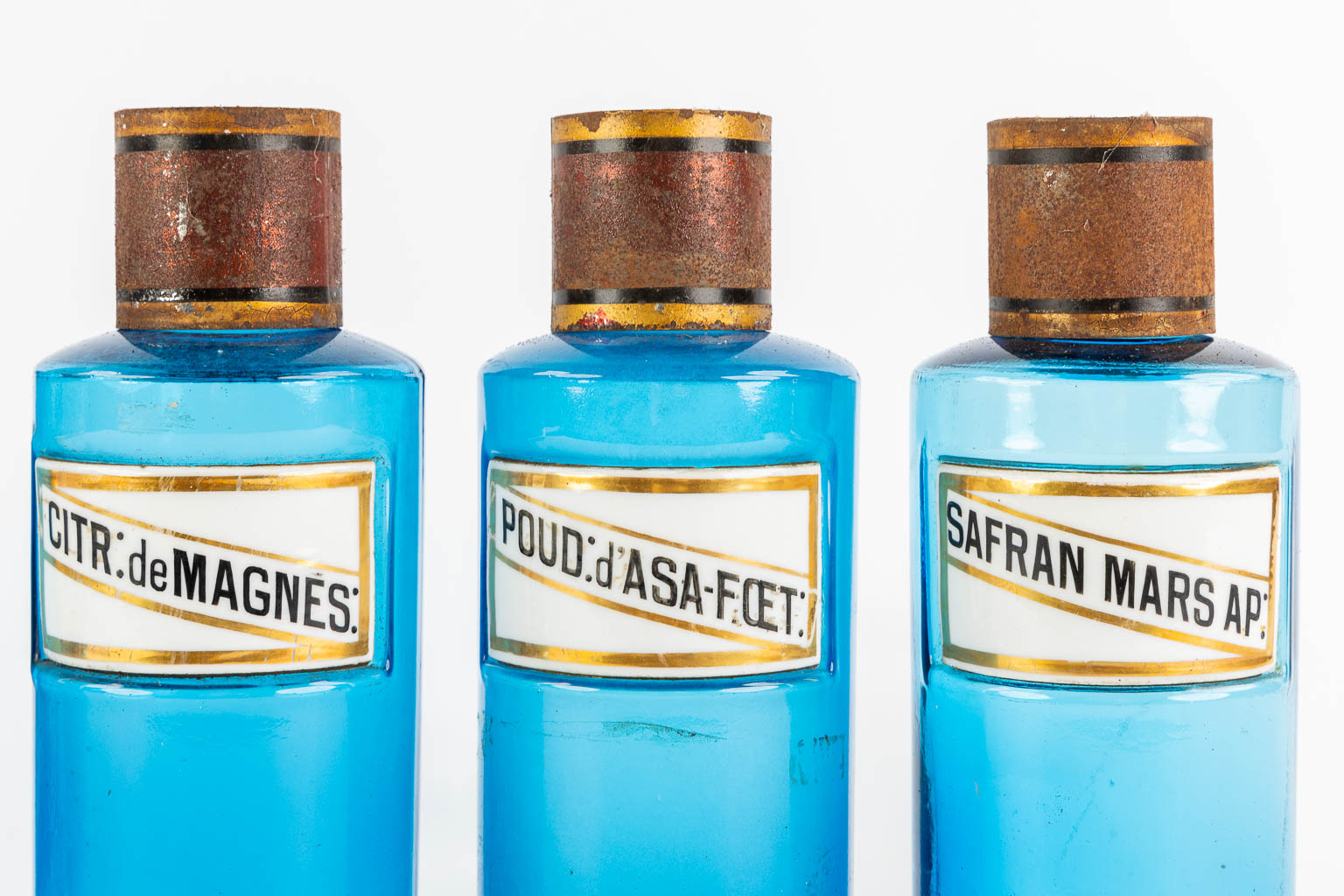 Six blue glass Pharmacy bottles with enamel plaques, circa 1880-1900. (H:23,5 x D:9,5 cm)