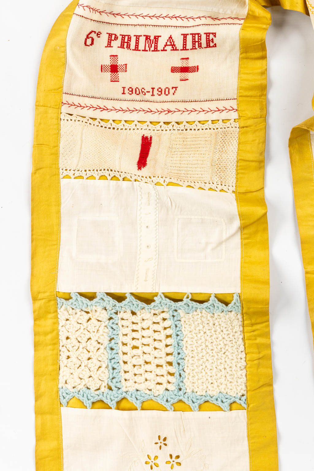 A large samplework with needlework, emboideries, knitting and lace. 1903. (L:596 cm)