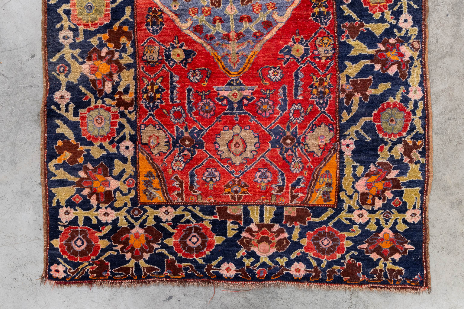 An Oriental hand-made carpet, dated 1939.. (W:124 x H:196 cm)