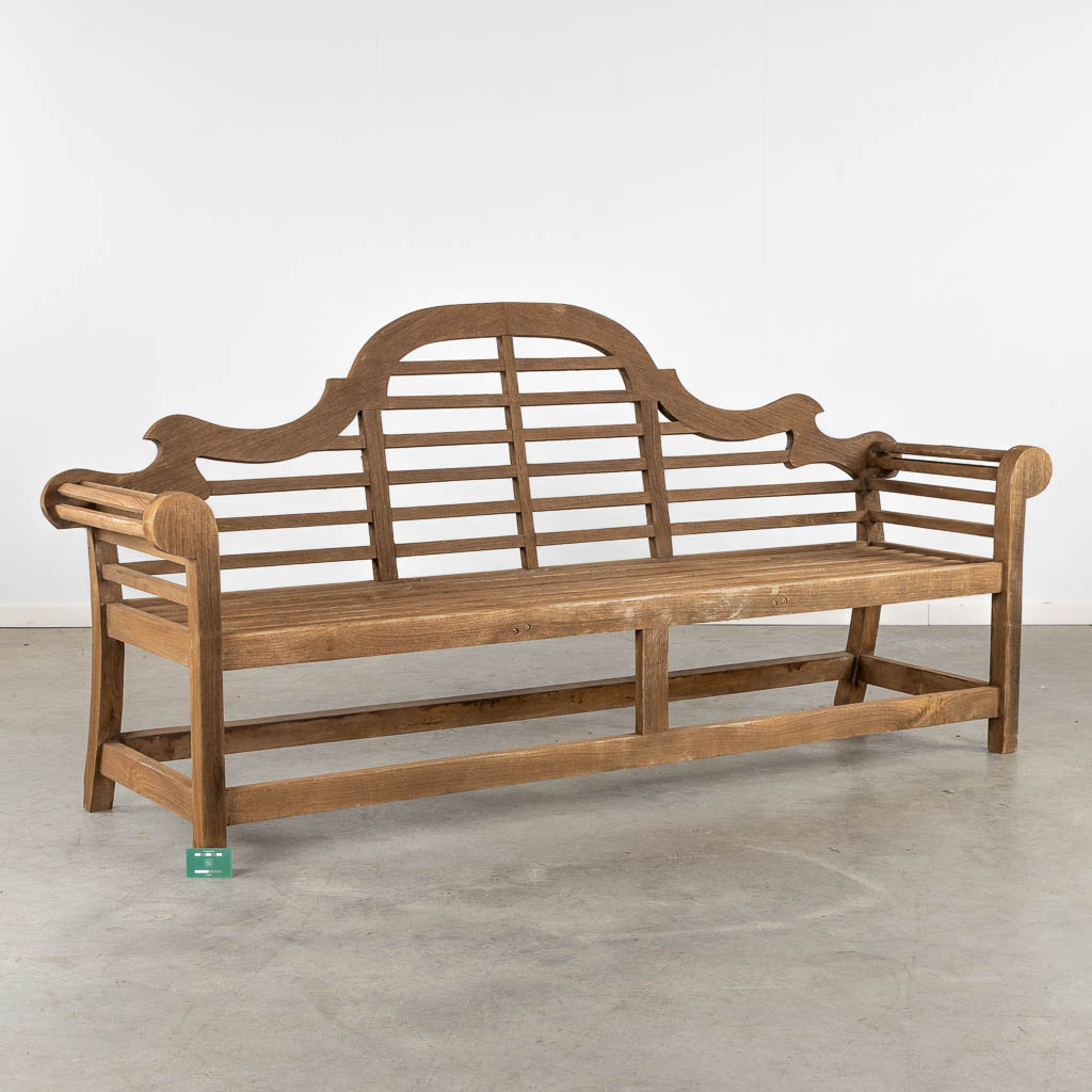 A large teak wood garden bench. (L:63 x W:226 x H:106 cm)