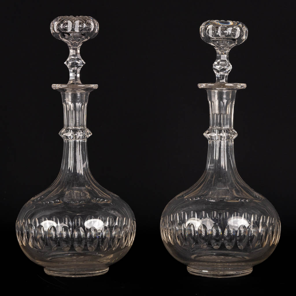 A matching set of 8 caraffes, added are a pair. Cut crystal. (H:34 cm)