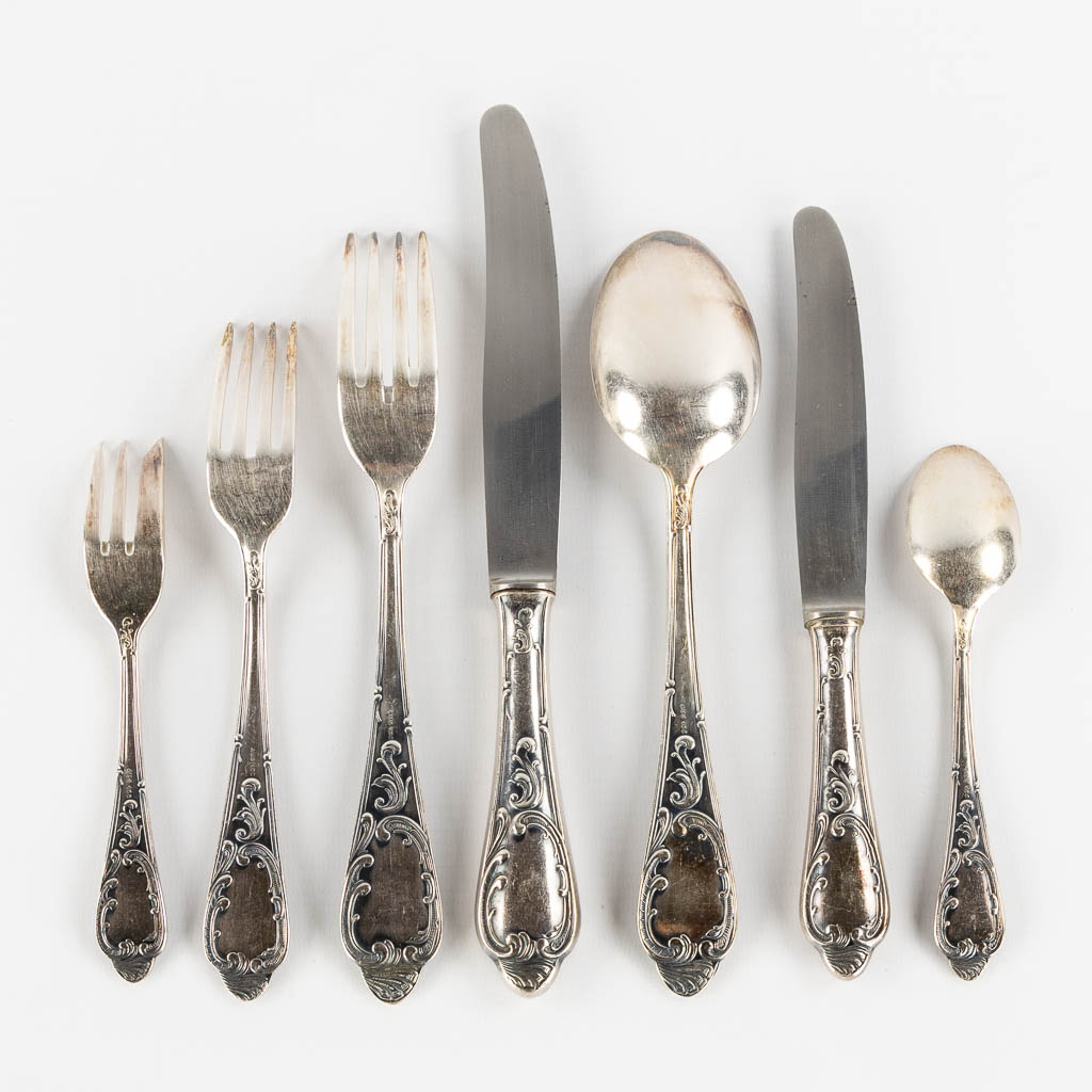 A 84-piece silver-plated cutlery in Louis XV style. (L:33 x W:40 x H:10 cm)