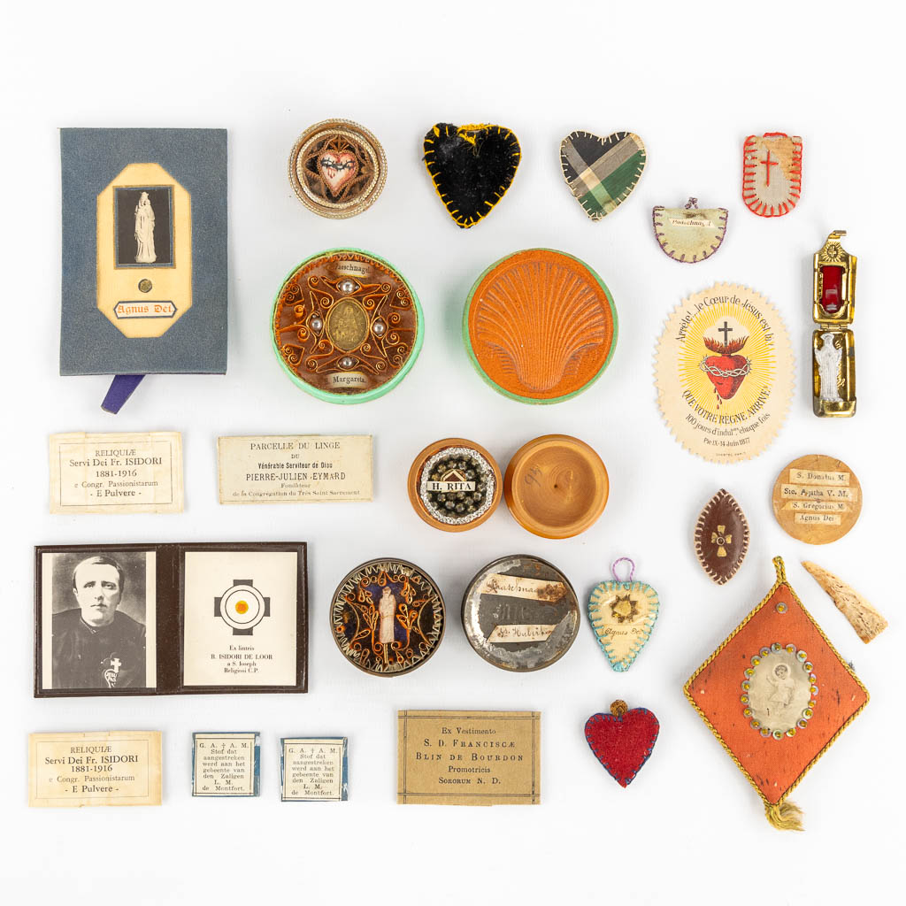 A collection of relics and religiosa, Paaschnagel, sealed paper relics and Agnus Dei. 