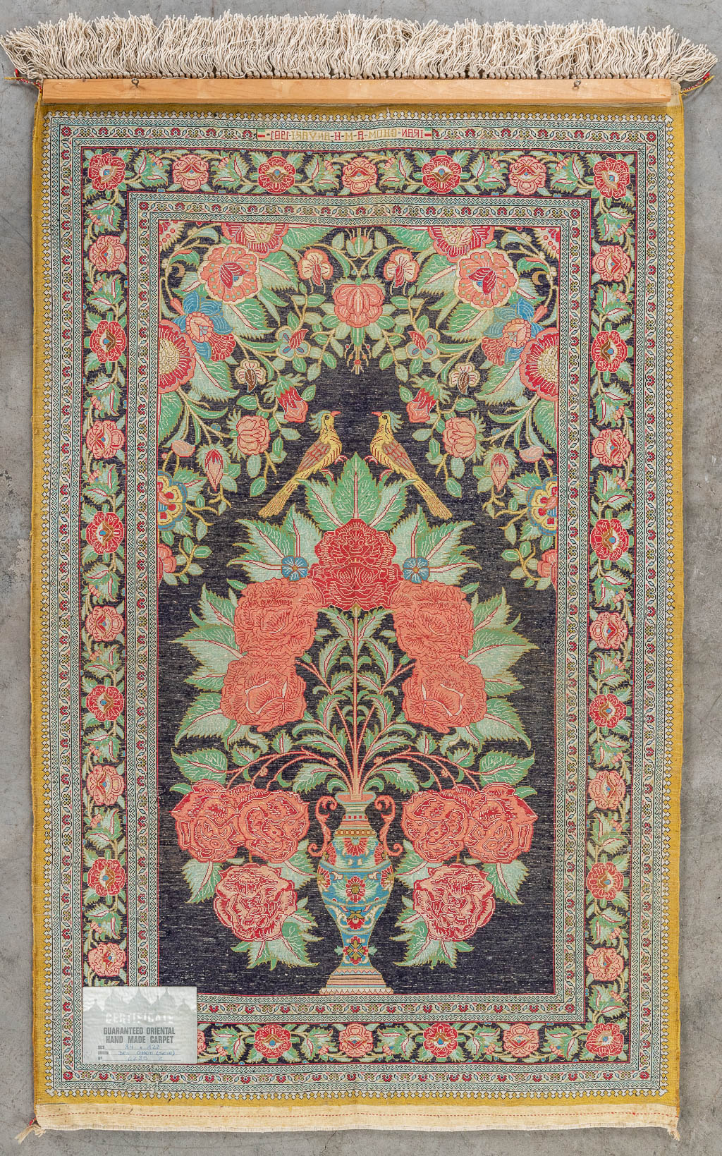 An antique Oriental hand-made carpet, silk. (L: 128 x W: 84 cm)