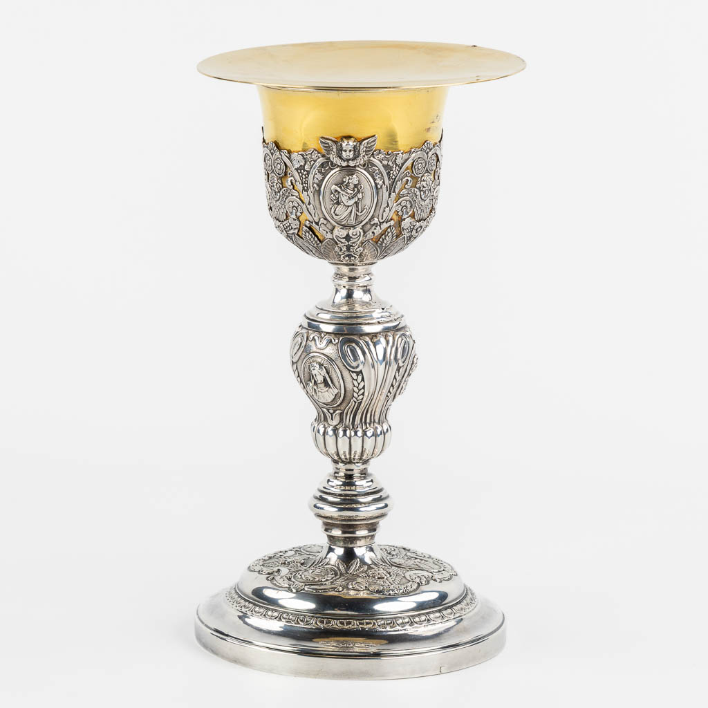 A silver chalice with a vemeil cuppa, rich decor in Baroque style. 19th C. (H:26 x D:14 cm)