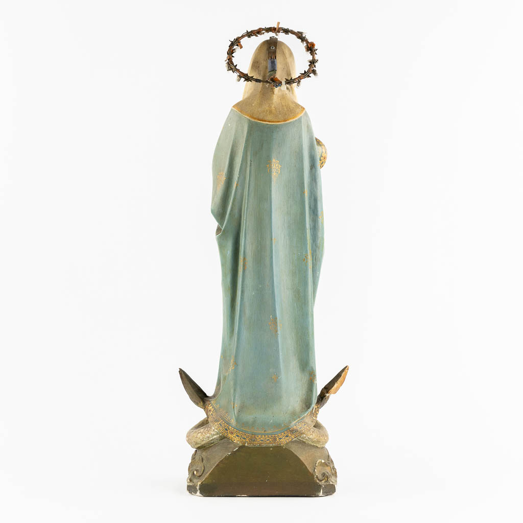 A Gothic Revival Virgin Mary on Crescent moon trampling the serpent, Polychrome plaster. Circa 1900. (H:81 cm)