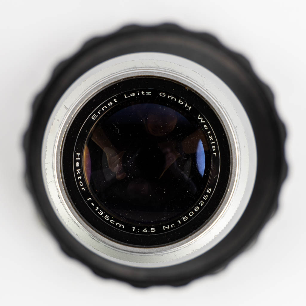 Leica, Four lenses and two filters. (H:15,5 cm)