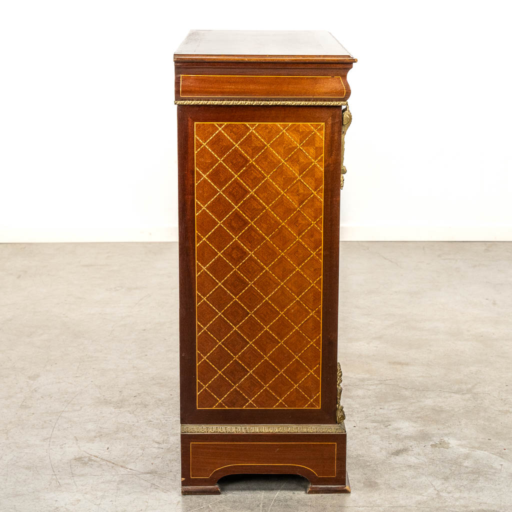 A single door cabinet, marquetry inlay mounted with bronze. 20th C. 