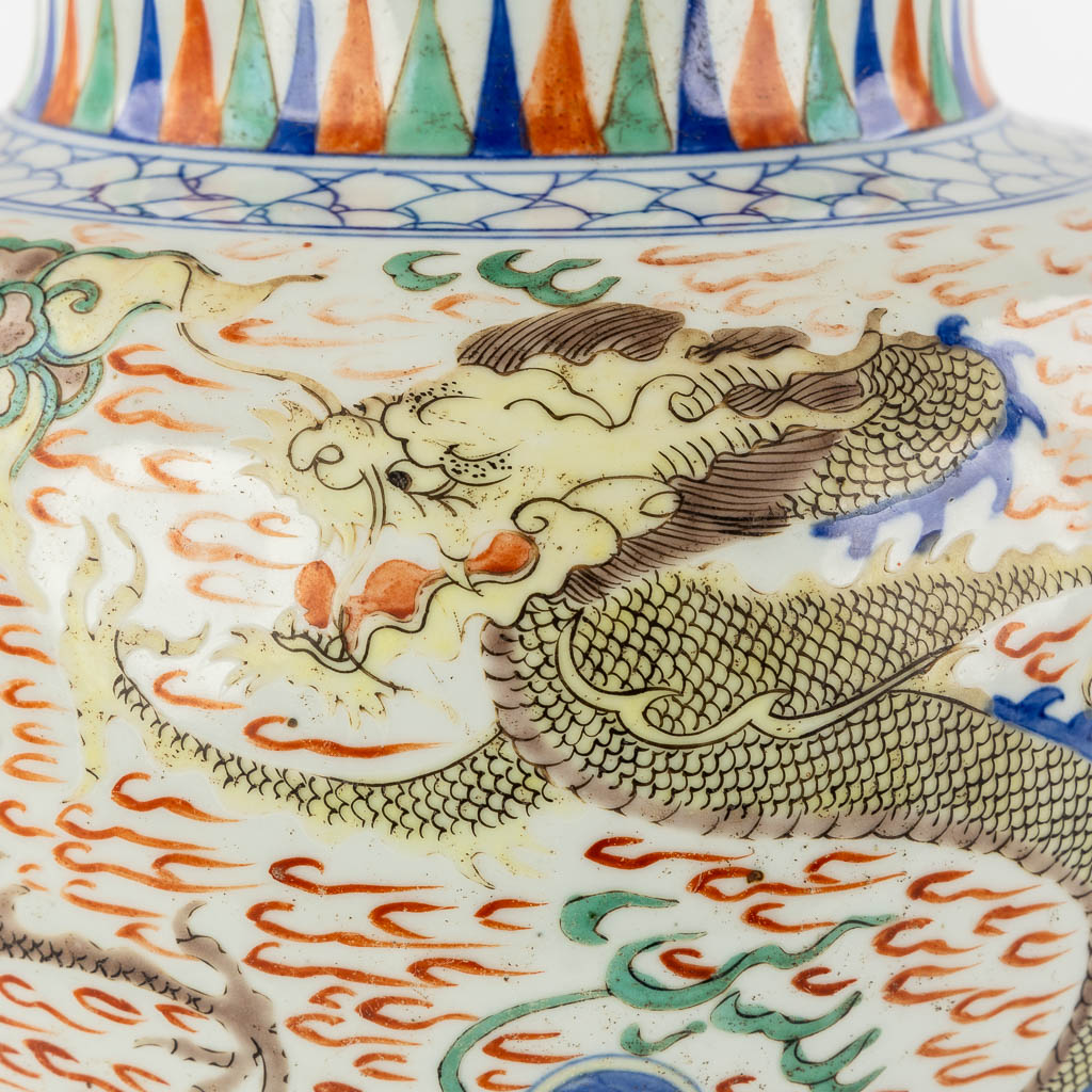 A Chinese Wucai vase with a dragon decor, 19th C.