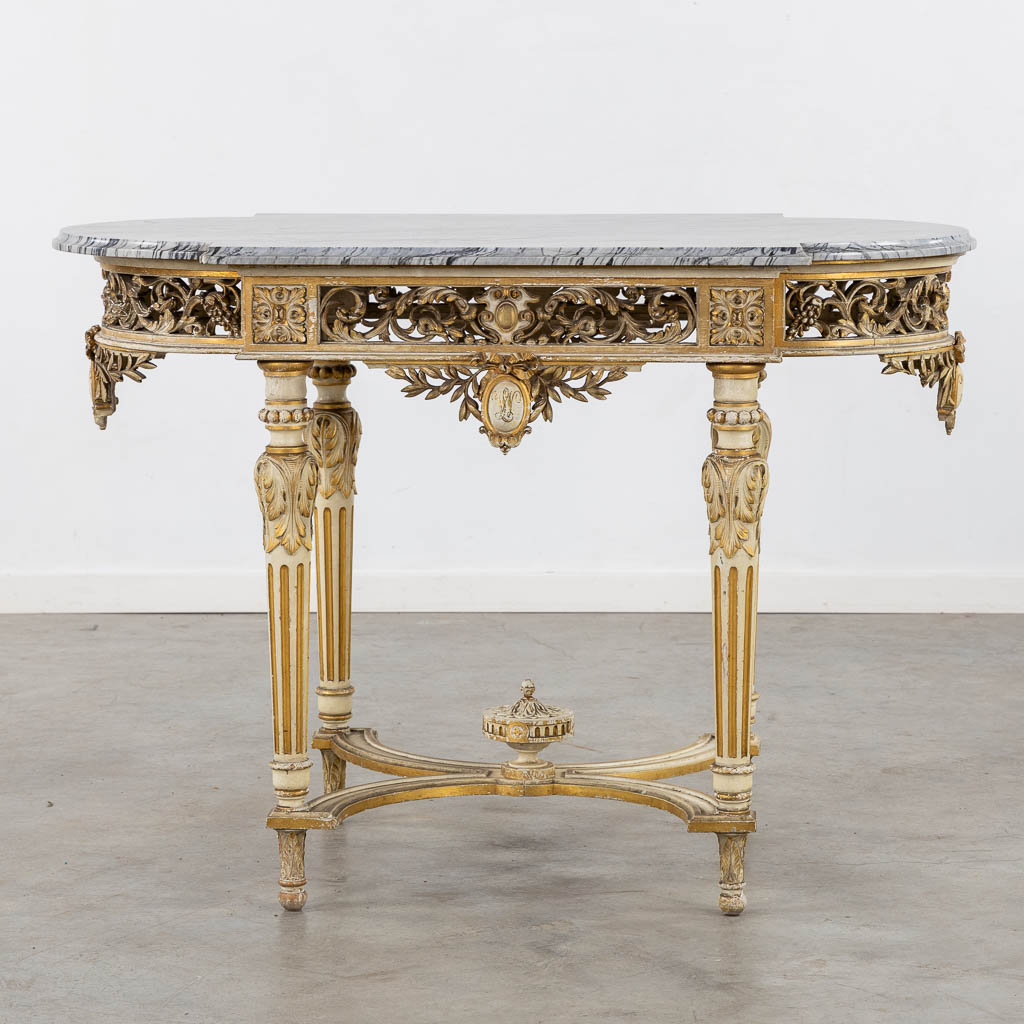 A wood-sculptured and patinated table with a grey marble, Louis XVI style. (L:65 x W:112 x H:80 cm)