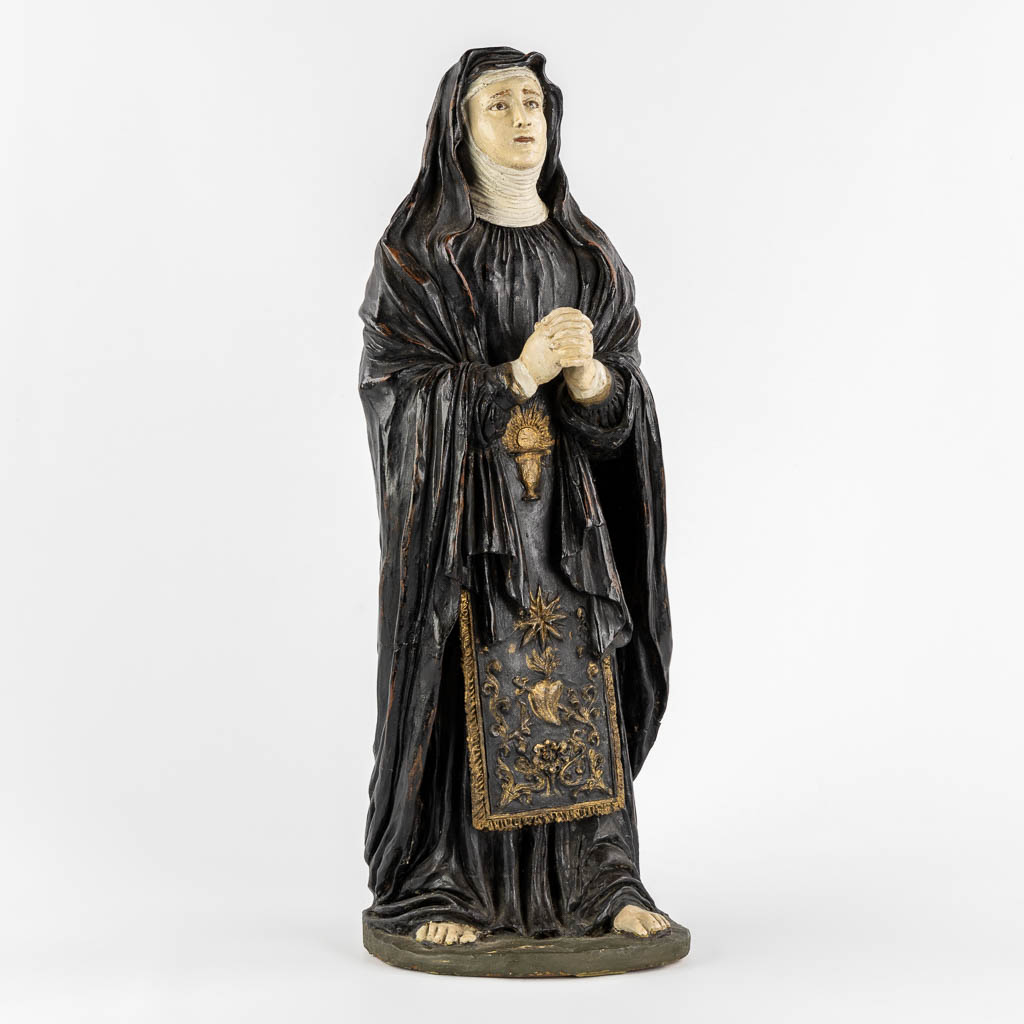 Saint Genoveva of Paris, polychrome terracotta with glass eyes. (W:17 x H:54 cm)