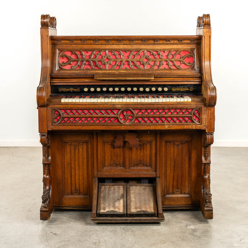 An antique organ, sculptured wood in Gothic Revival style. Circa 1900.