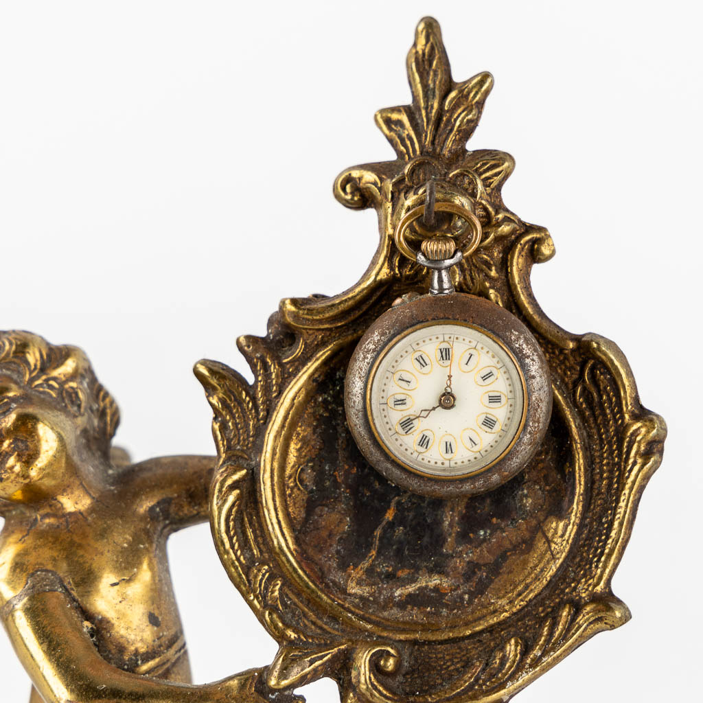 Four decorative pocket watch holders, with 4 pocket watches. Roskopf and others.