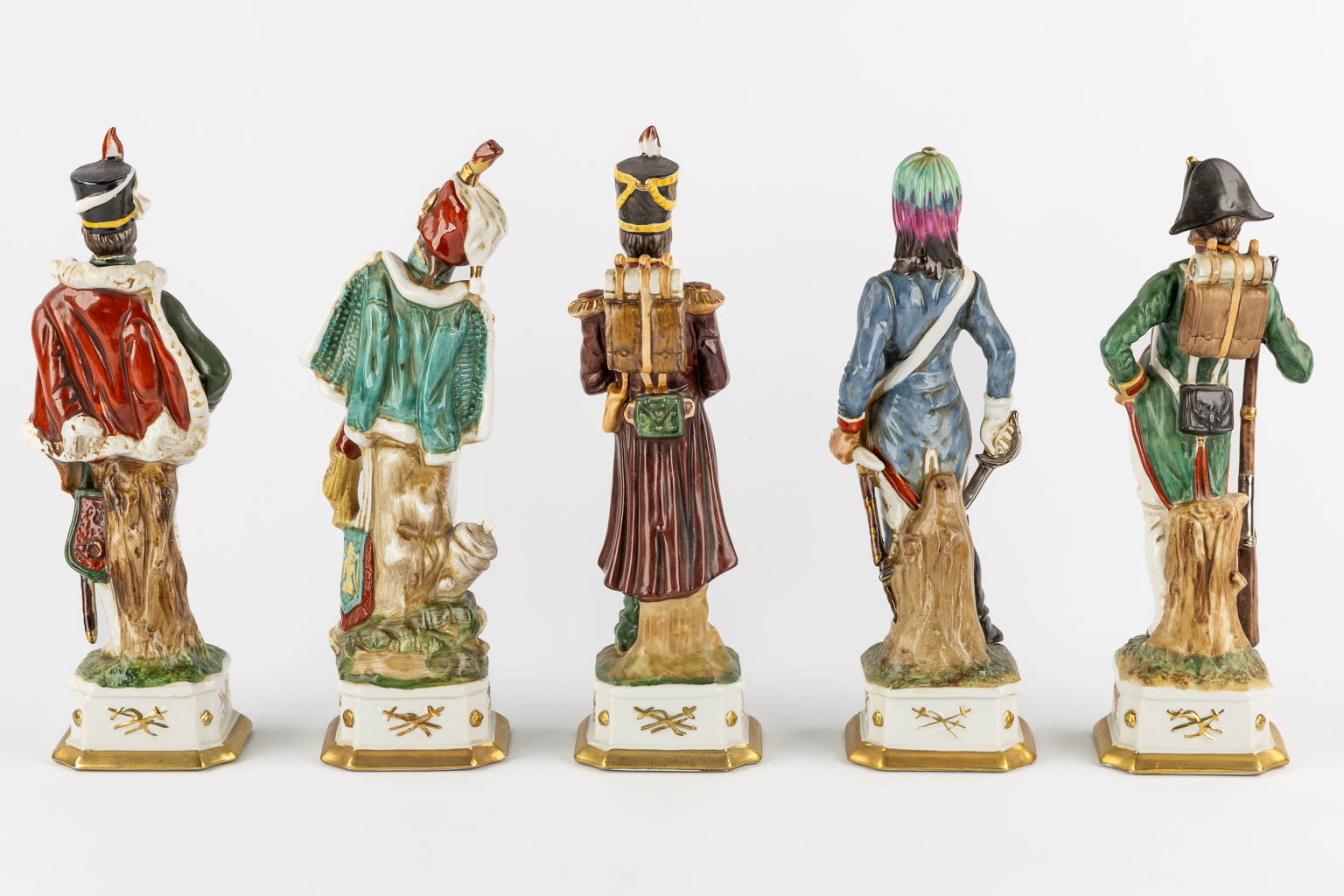 Napoleon and the generals, polychrome porcelain. 15 + 3 pieces. (L:9,5 x W:10 x H:31 cm)