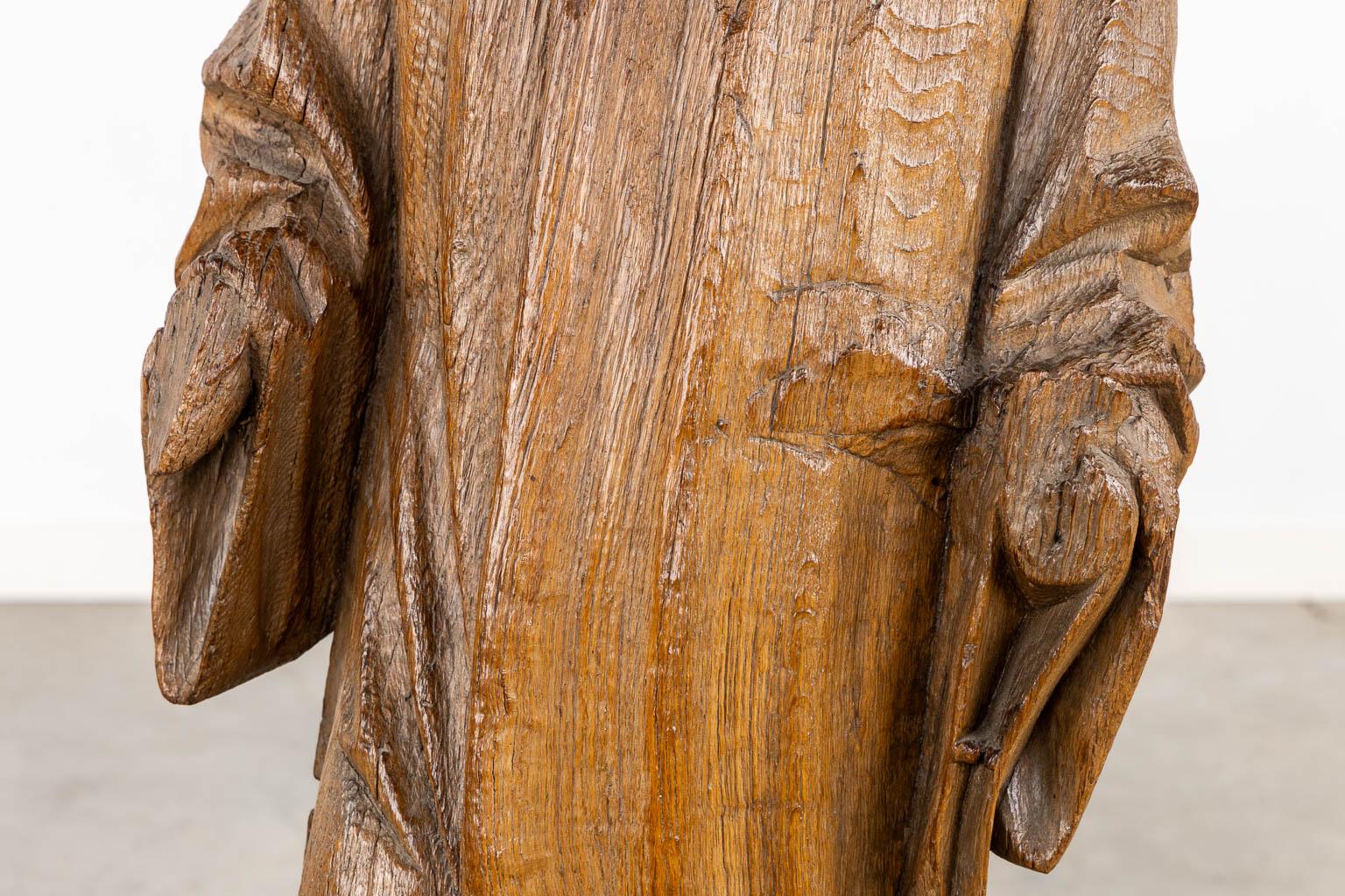 An antique, wood-sculptured figurine of Dacon Laurentius, Gothic, circa 1400. (L:22 x W:36 x H:117 cm)