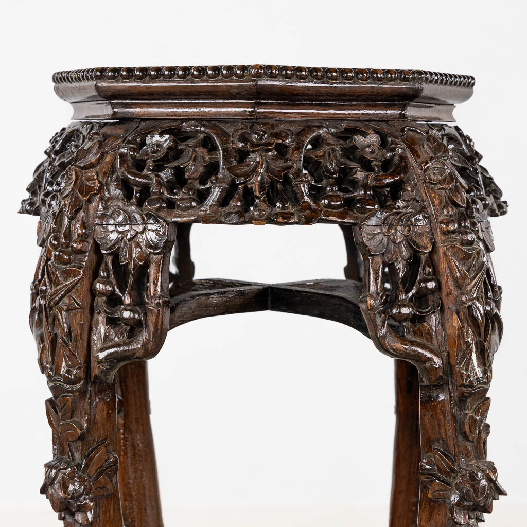 A high Oriental pedestal, sculptured hardwood with marble. (L:50 x W:50 x H:90 cm)