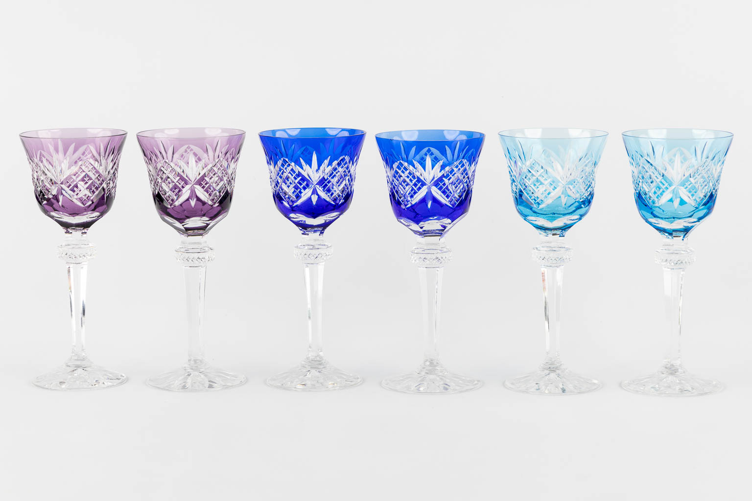 Cristallerie De Lorraine, 12 coloured goblets, added are 4 Val Saint Lambert goblets. (H:20 cm)