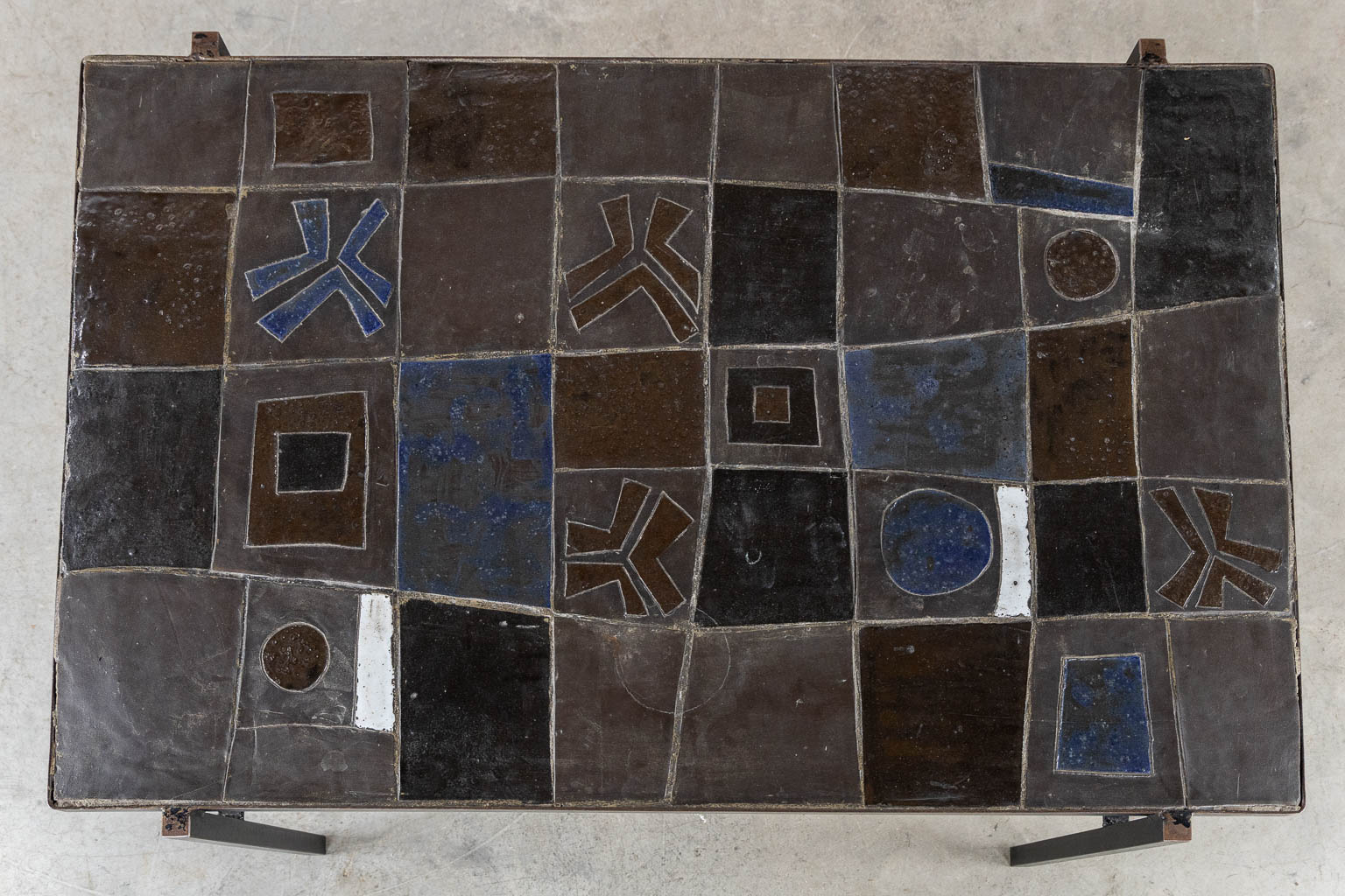 A mid-century coffee table, ceramic tiles on a metal base, circa 1970. (L:75 x W:110 x H:50 cm)