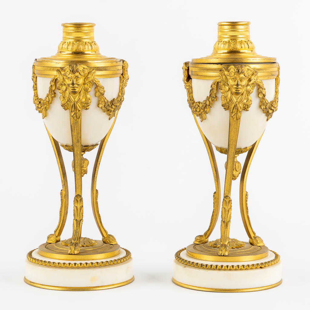 A pair of Cassolettes with a Candelabra, gilt bronze on Carrara marble. 19th C. (H:24 x D:9,5 cm)