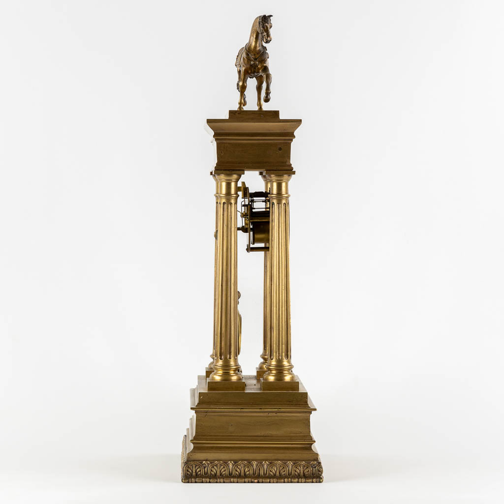 An antique column clock, bronze with a horse figurine. 19th C. (L:18 x W:27 x H:62 cm)