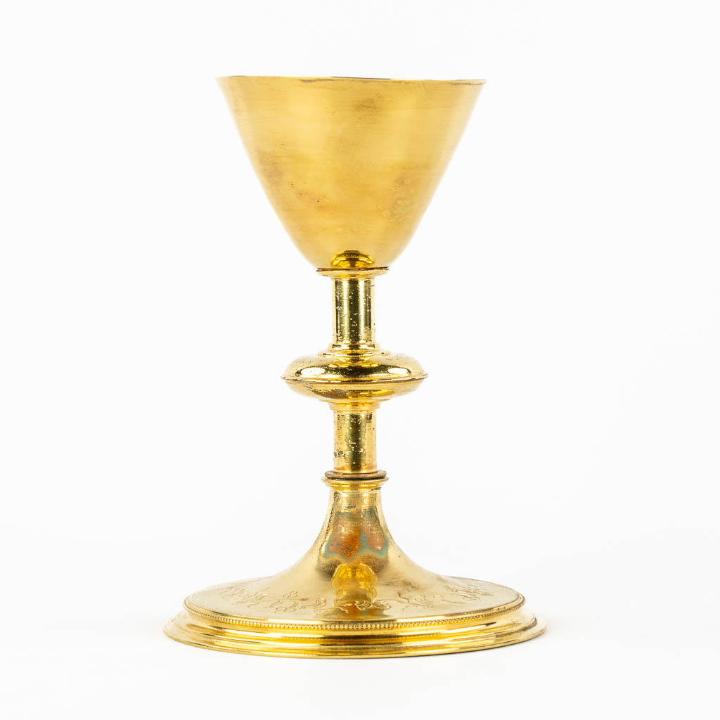 A Gothic Revival Chalice, gold-plated brass with an enamel plaque. 19th C.