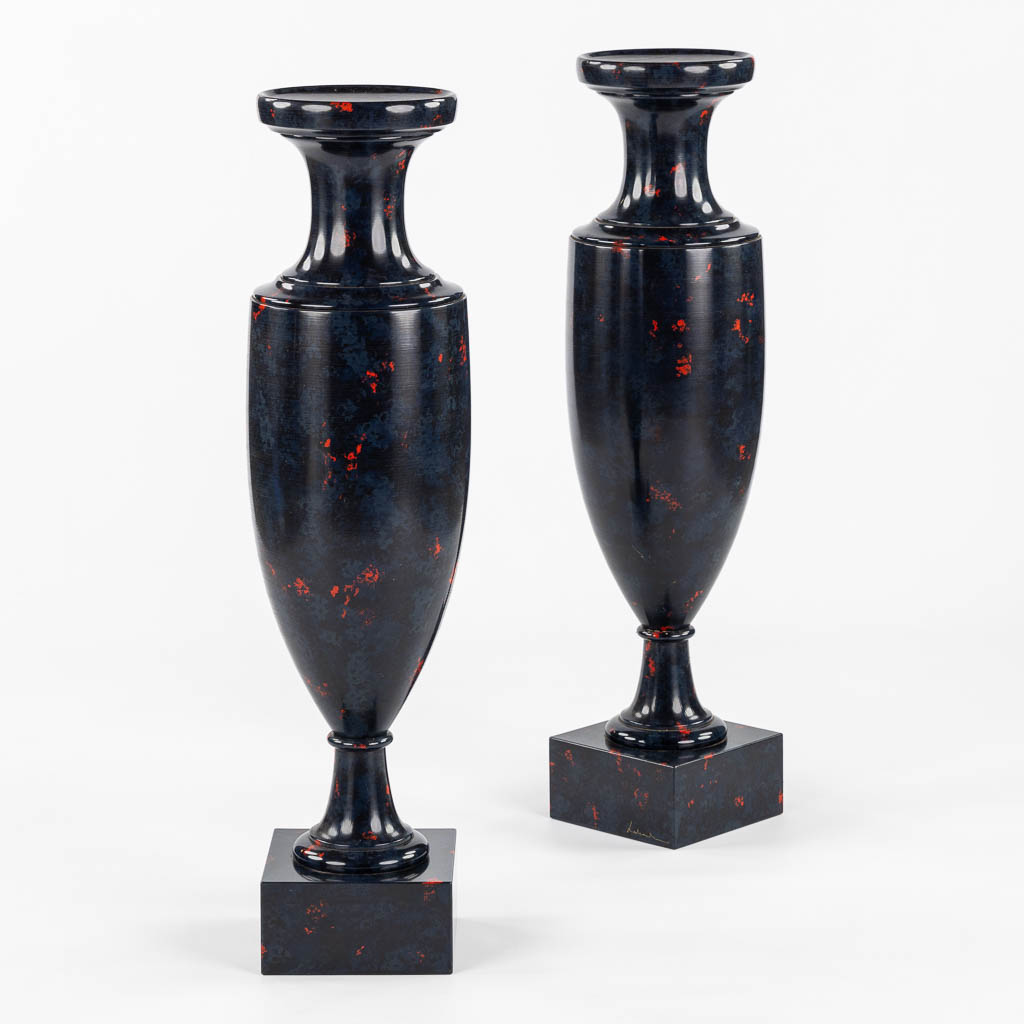 A pair of higly decorative and large urns, wood turned with a 'Faux Marble' decor.