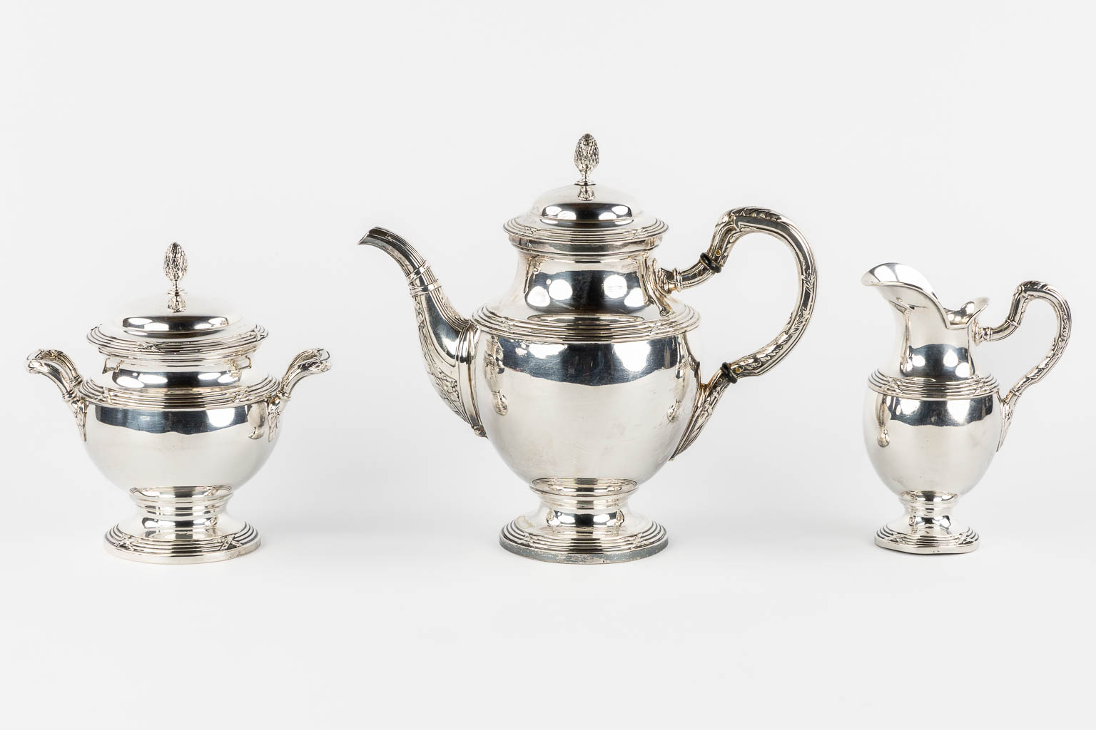 A three-piece silver coffee service, Louis XVI style, Germany, 800/1000. 1,115kg. 