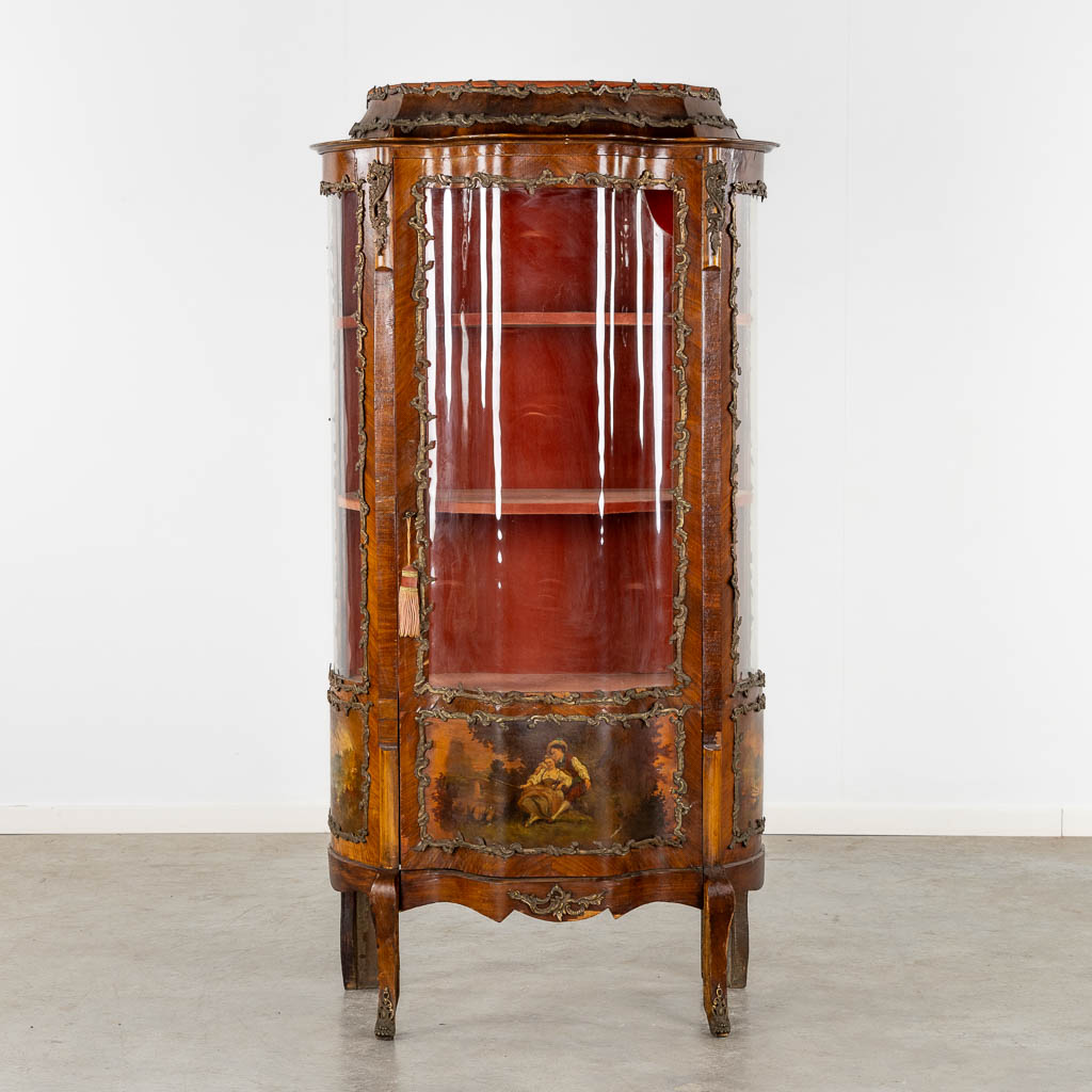 A display cabinet with painted scène, curved glass and mounted with bronze. (L:45 x W:80 x H:169 cm)