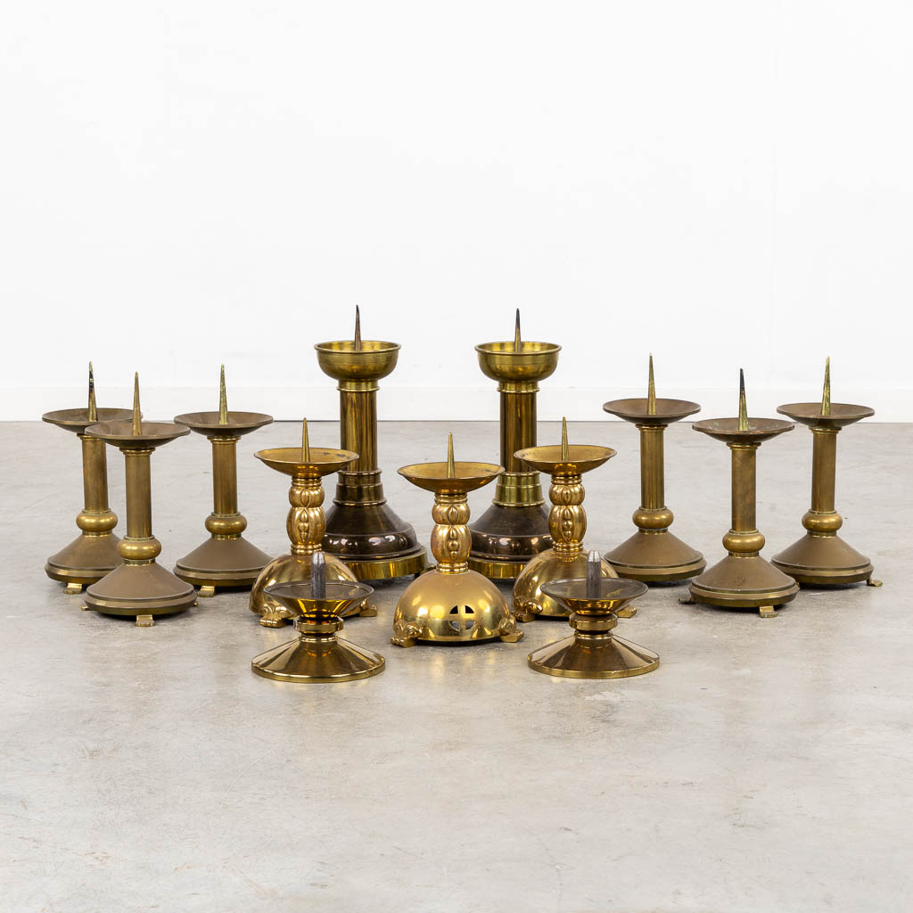 Thirteen Chruch candlesticks, brass and bronze. (H:40 cm)