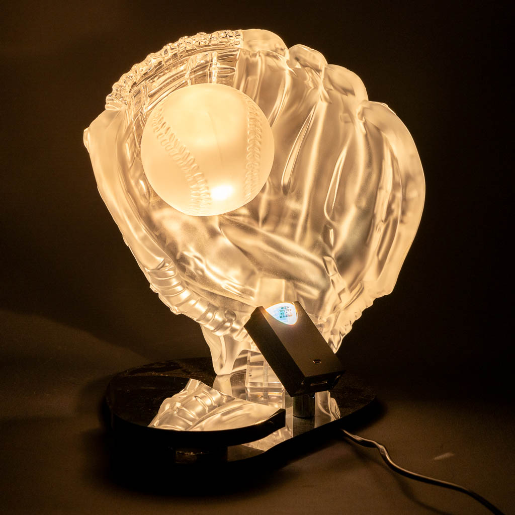 Christalleries Royales De Champagne. A baseball glove table lamp, Glass. (L:25 x H:28 cm)