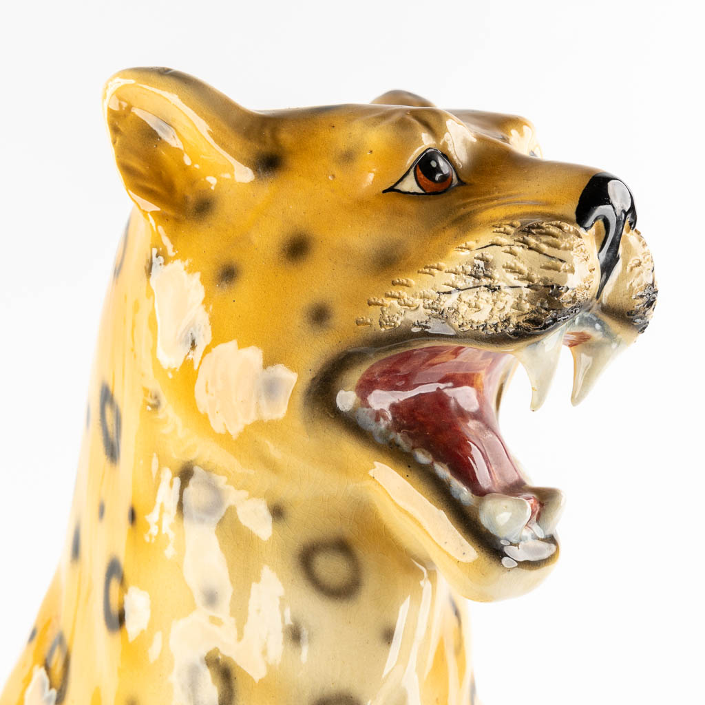 A large glazed faience Leopard, Italy, 20th C. (L:33 x W:46 x H:73 cm)