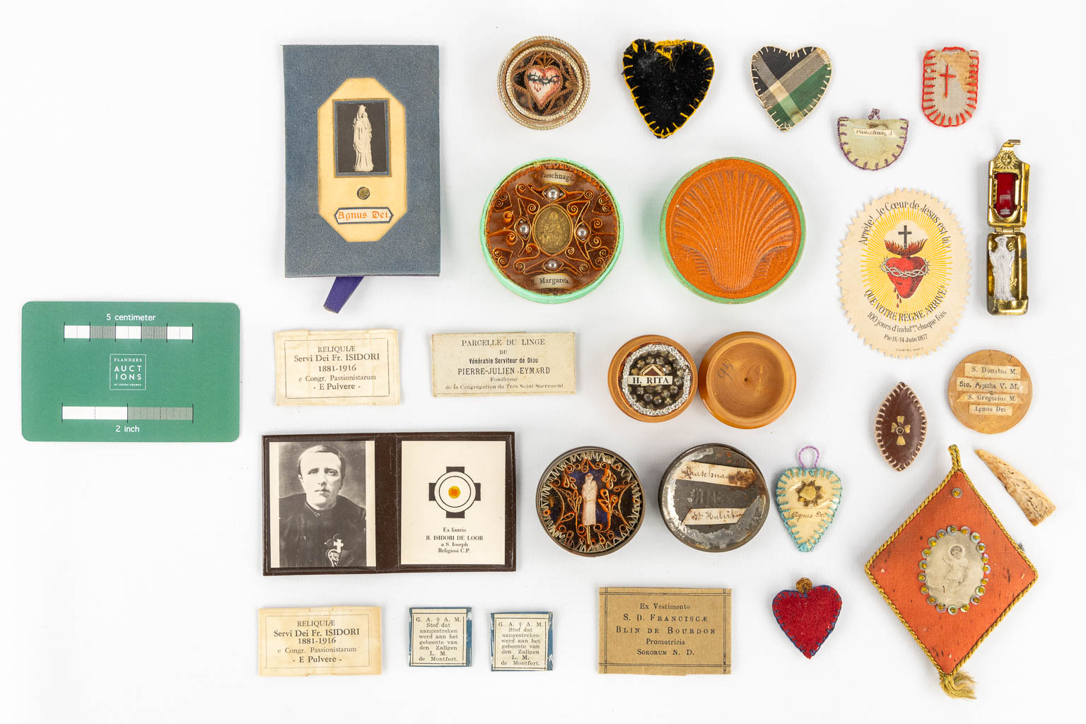 A collection of relics and religiosa, Paaschnagel, sealed paper relics and Agnus Dei. 