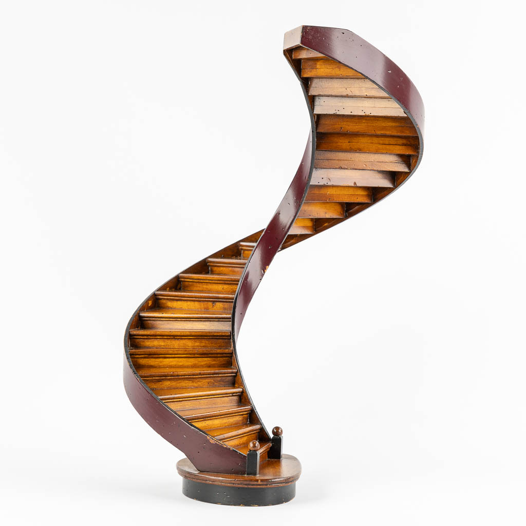 An architectural model of a revolving staircase, wood. 20th C. (H:47,5 x D:29 cm)