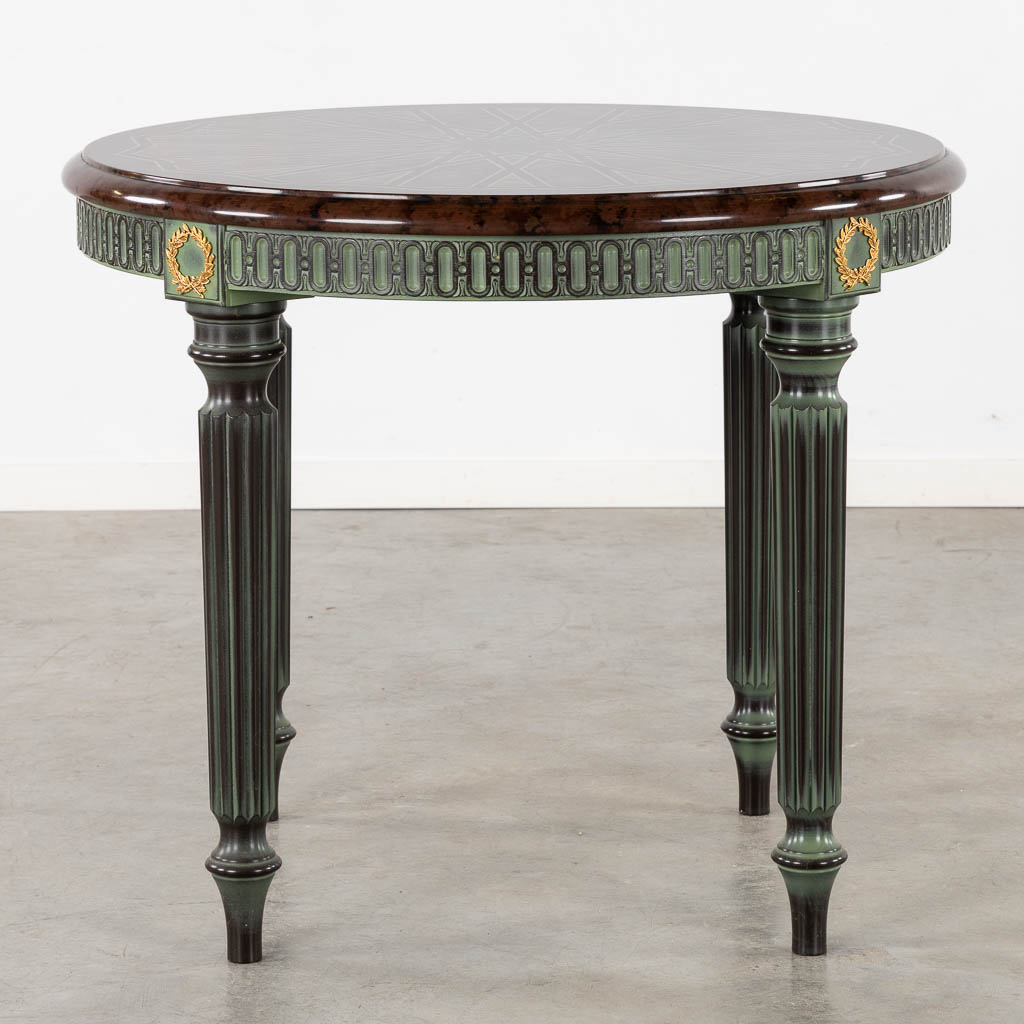 A decorative table with geometric pattern, Louis XVI style base.