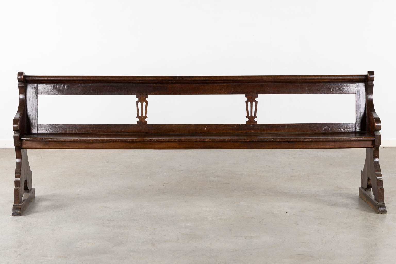 An antique Chruch bench, dark patinated oak, 18th C. (L:54 x W:239 x H:90 cm)