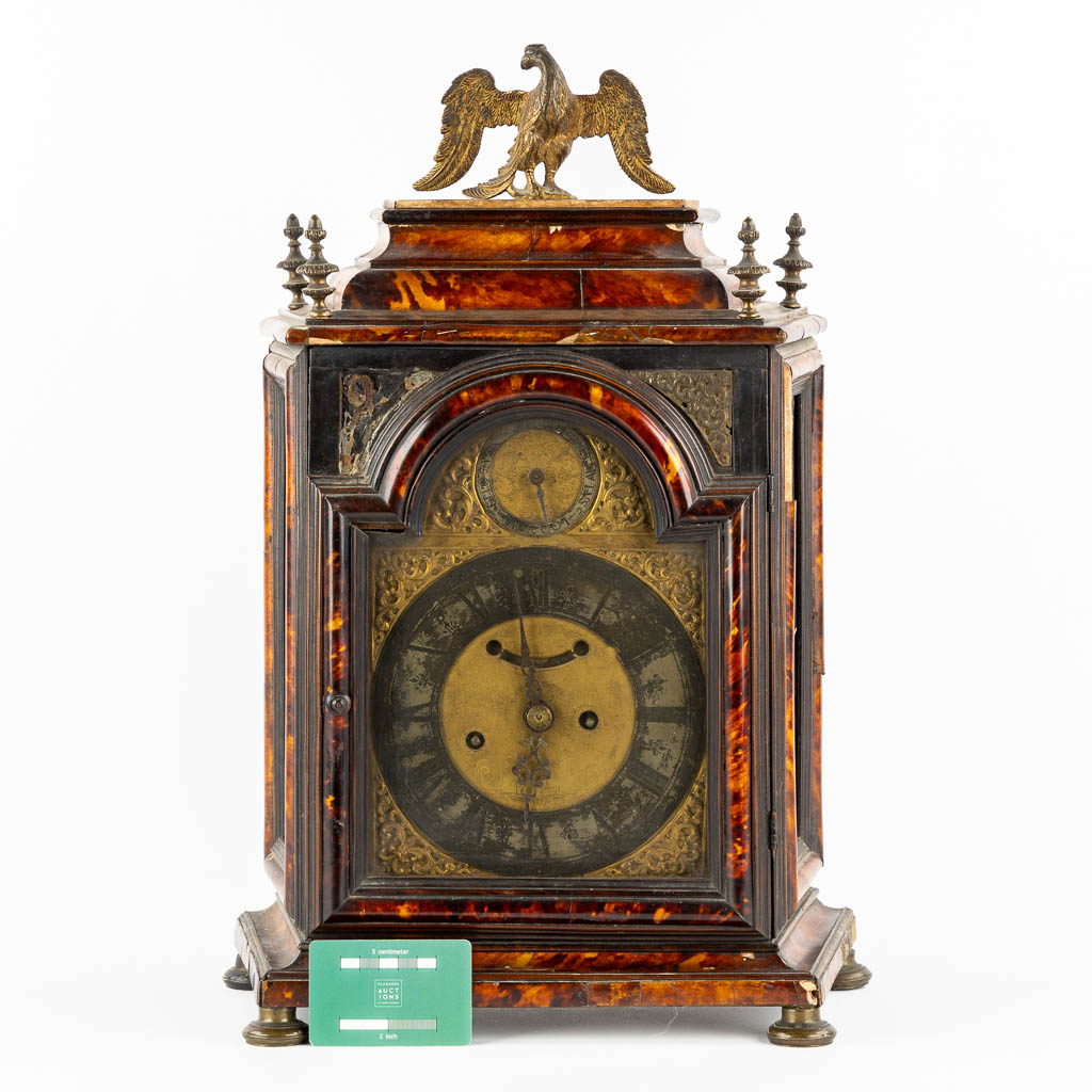 An antique Sicilian mantle clock, mounted with tortoiseshell and gilt bronze. Italy, 18th C. (L:20 x W:36 x H:53 cm)