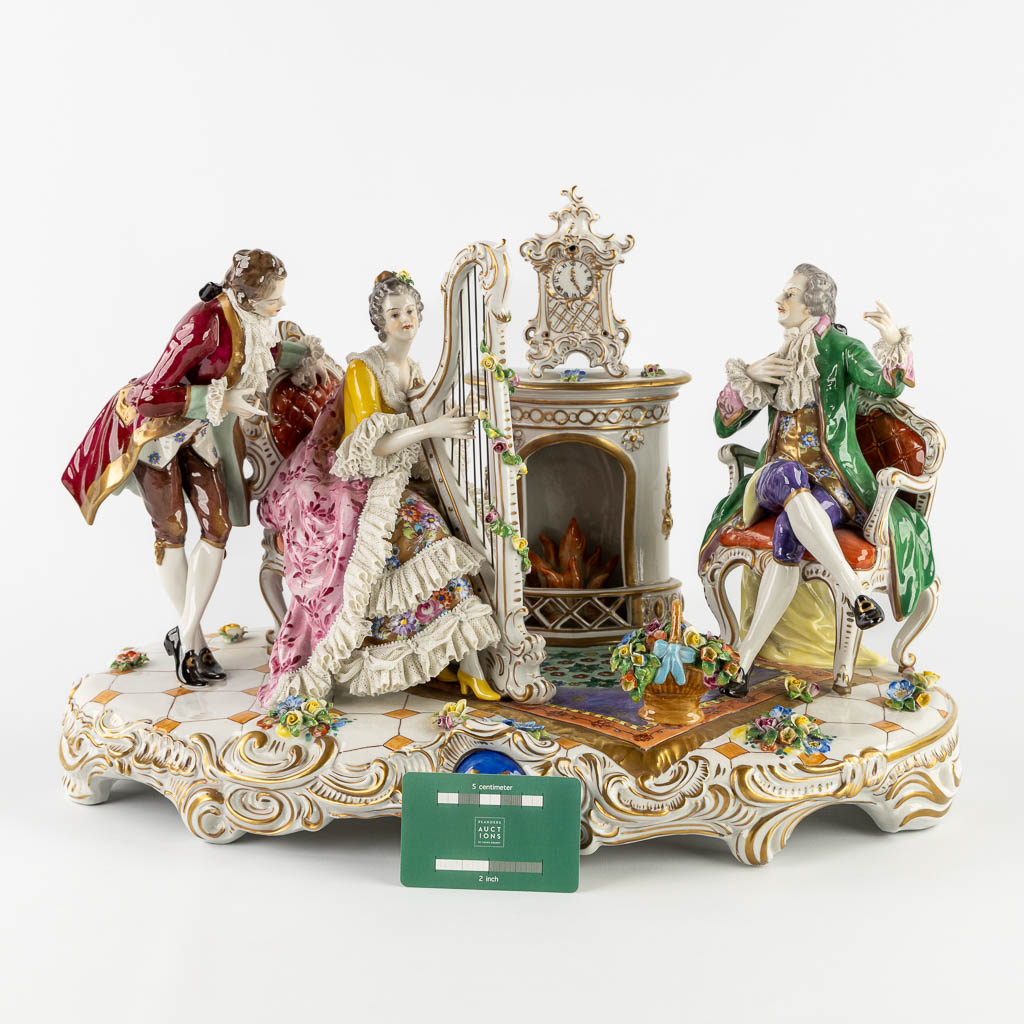 Volkstedt Rudolstadt, a large group 'Playing the harp' polychrome porcelain. 