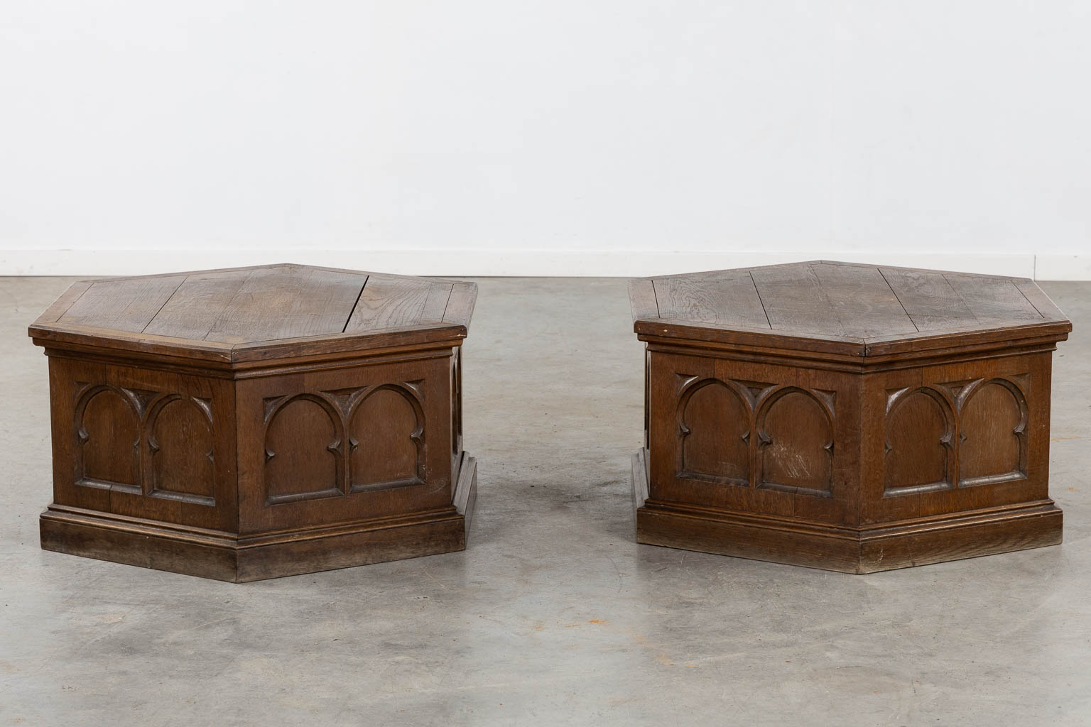 A pair of pedestals for large candelabra, sculptured oak, Gothic Revival. (H:40 x D:76 cm)