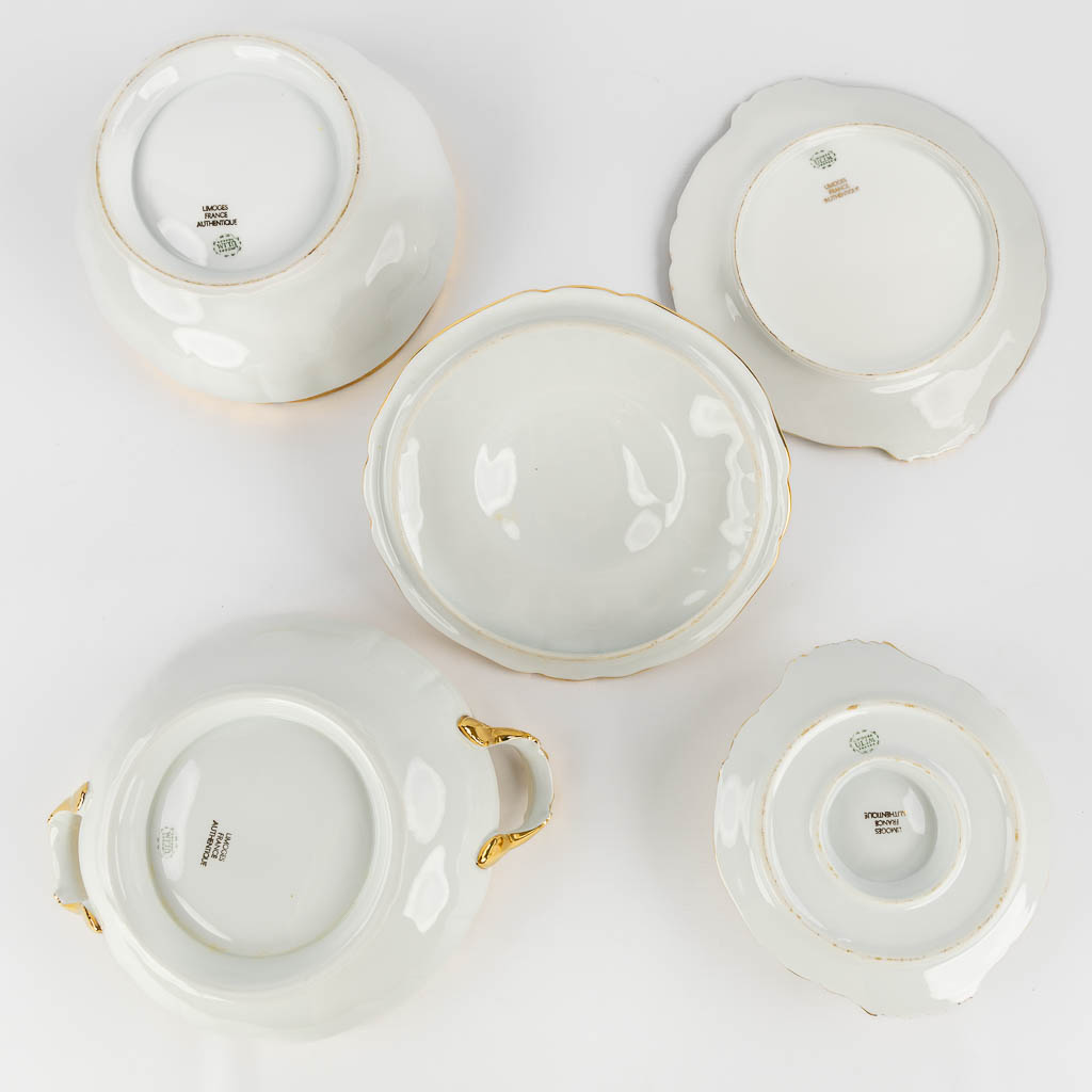 ULIM Limoges, a large dinner and coffee service, porcelain with a gilt rim. (L:26 x W:31 x H:20 cm)