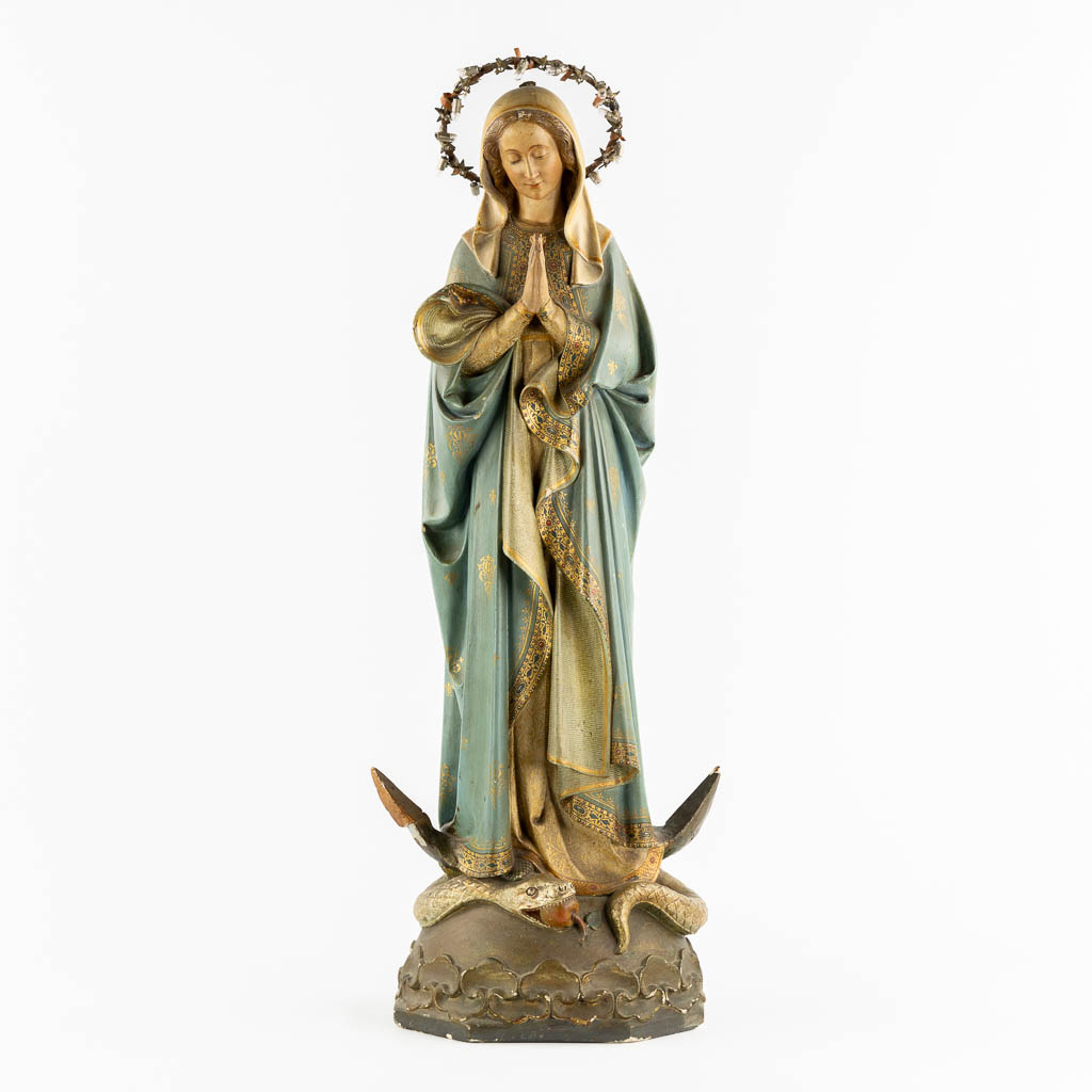 A Gothic Revival Virgin Mary on Crescent moon trampling the serpent, Polychrome plaster. Circa 1900. (H:81 cm)