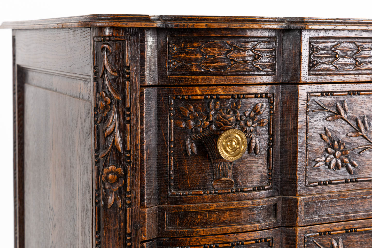 A three-drawer commode, floral wood-sculptures in a Louis XVI style. (L:60 x W:110 x H:99 cm)