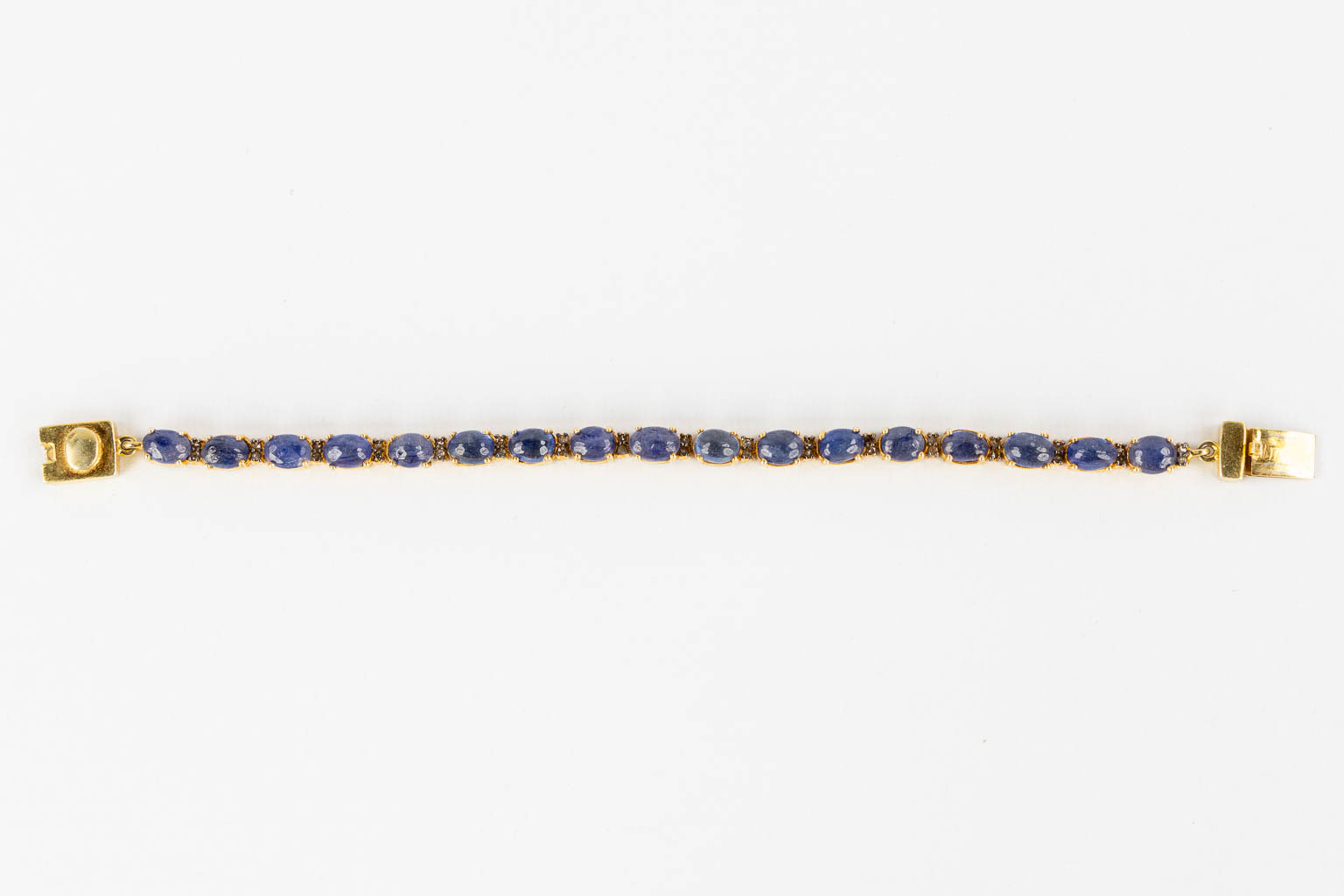 A bracelet, gilt silver with cabochon Sapphires and old cut diamonds. 23,35g. 