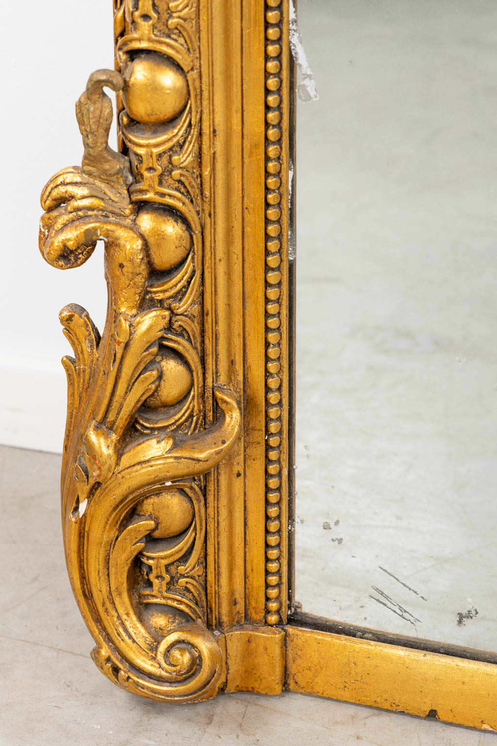 A mirror, sculptured wood, and stucco in a Louis XV style. 20th C. (W:110 x H:218 cm)