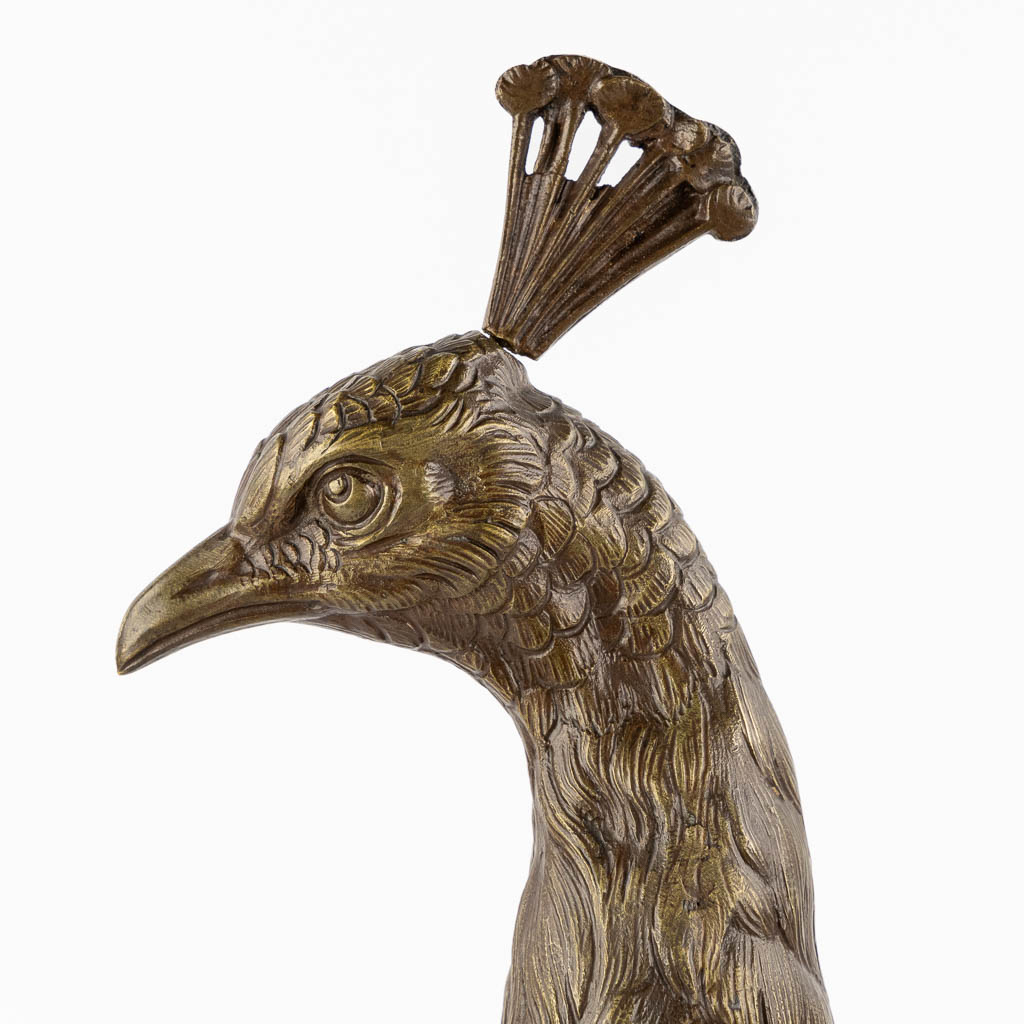 L. MAUPERTUIS (XX) A decorative figurine of a Peacock, patinated bronze. (L:17 x W:57 x H:50 cm)