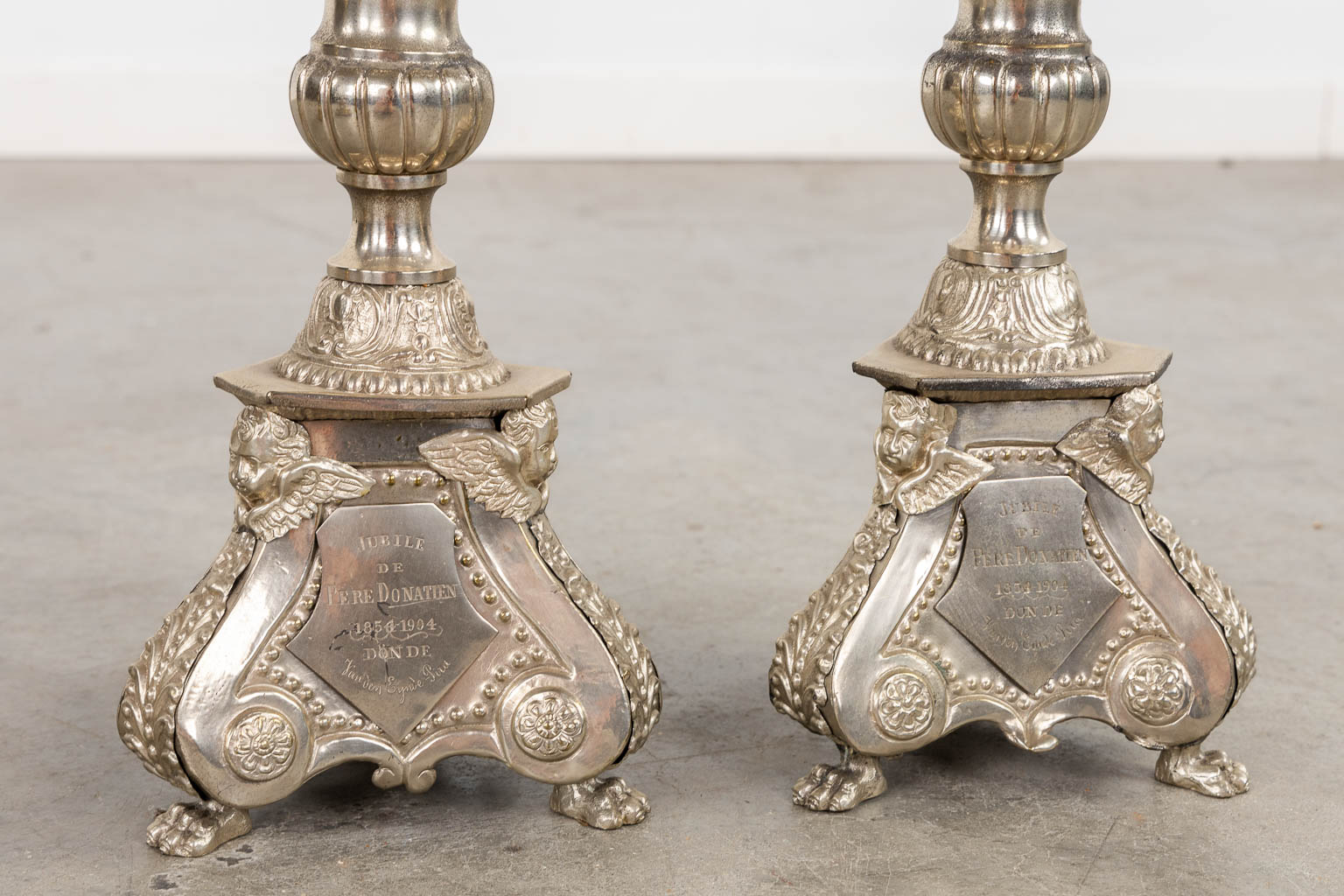 A pair of silver-plated church chandelsticks, added a pair of brass candelabra. (H:92 cm)