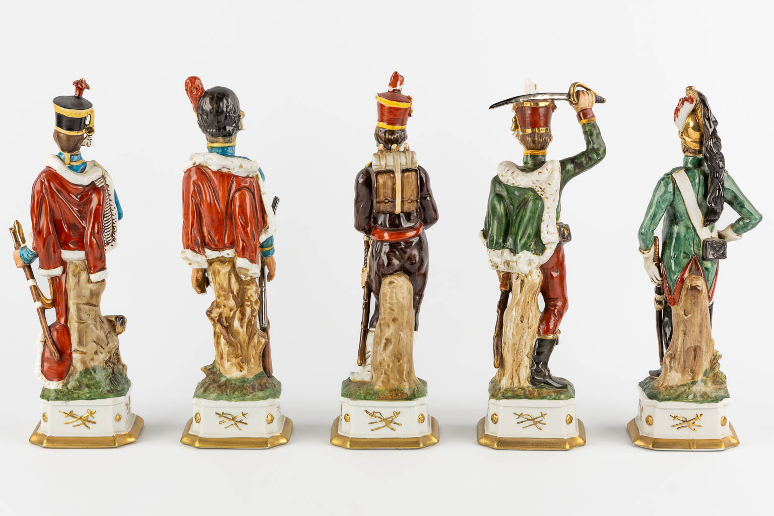 Napoleon and the generals, polychrome porcelain. 15 + 3 pieces. (L:9,5 x W:10 x H:31 cm)