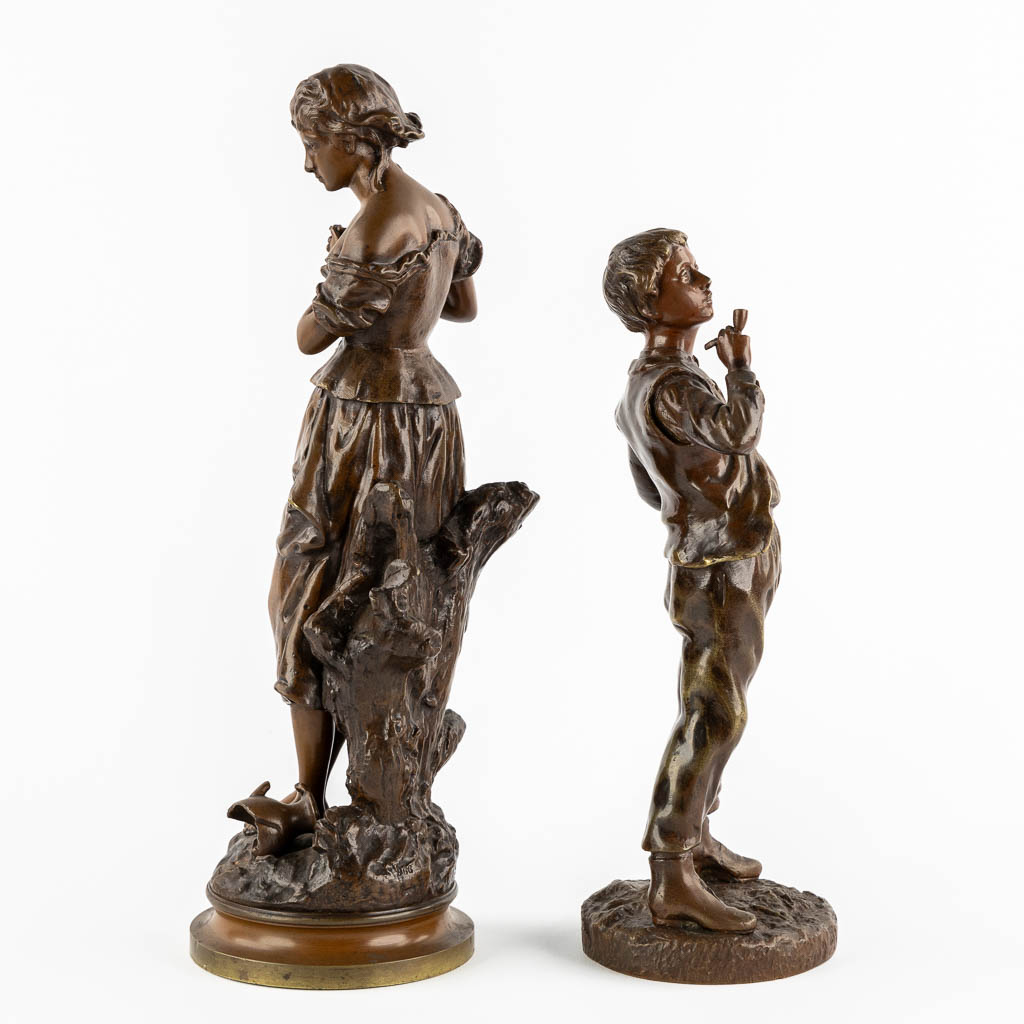 Twee gepatineerde bronzen figuren van een Dame en Roker, circa 1900.