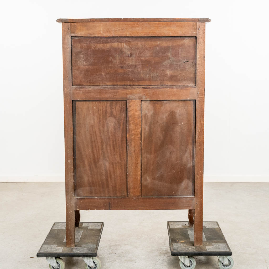 A two door-cabinet, sculptured wood finished with root-wood veneer. 